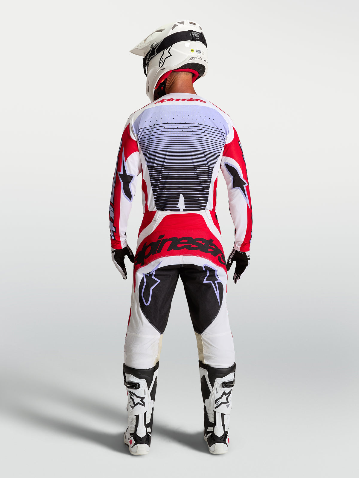 Alpinestars Techstar Maven, ensemble de motocross homme, maillot et pantalon rouges et blancs, vue arrière, coupe athlétique.