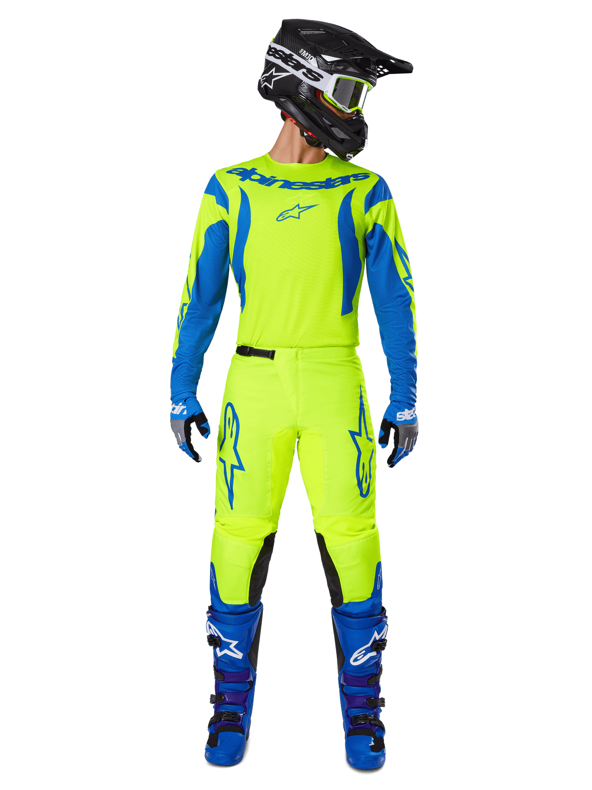 Ensemble d'équipement Alpinestars 2025 Fluid Haul, maillot et pantalon de motocross, jaune fluo et bleu, porté avec des bottes bleues assorties et un casque noir, présentant des logos Astars imposants et une coupe ergonomique athlétique pour la course tout-terrain.
