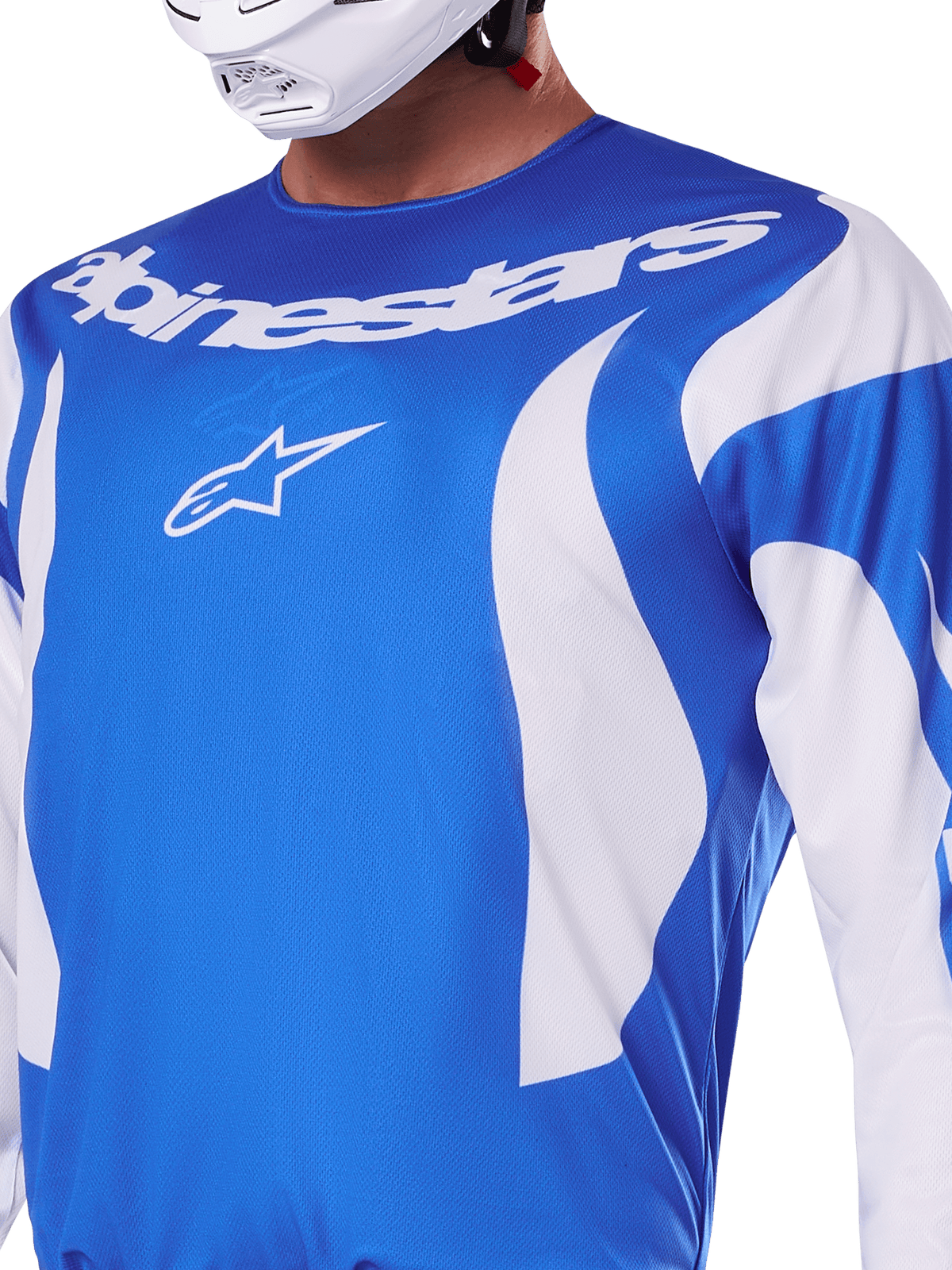 Alpinestars 2025 Fluid Haul Jersey, Blue and White, worn by a rider with a white helmet, featuring a white Alpinestars wordmark and A-star logo, athletic fit, lightweight moisture-wicking material for motocross and off-road riding