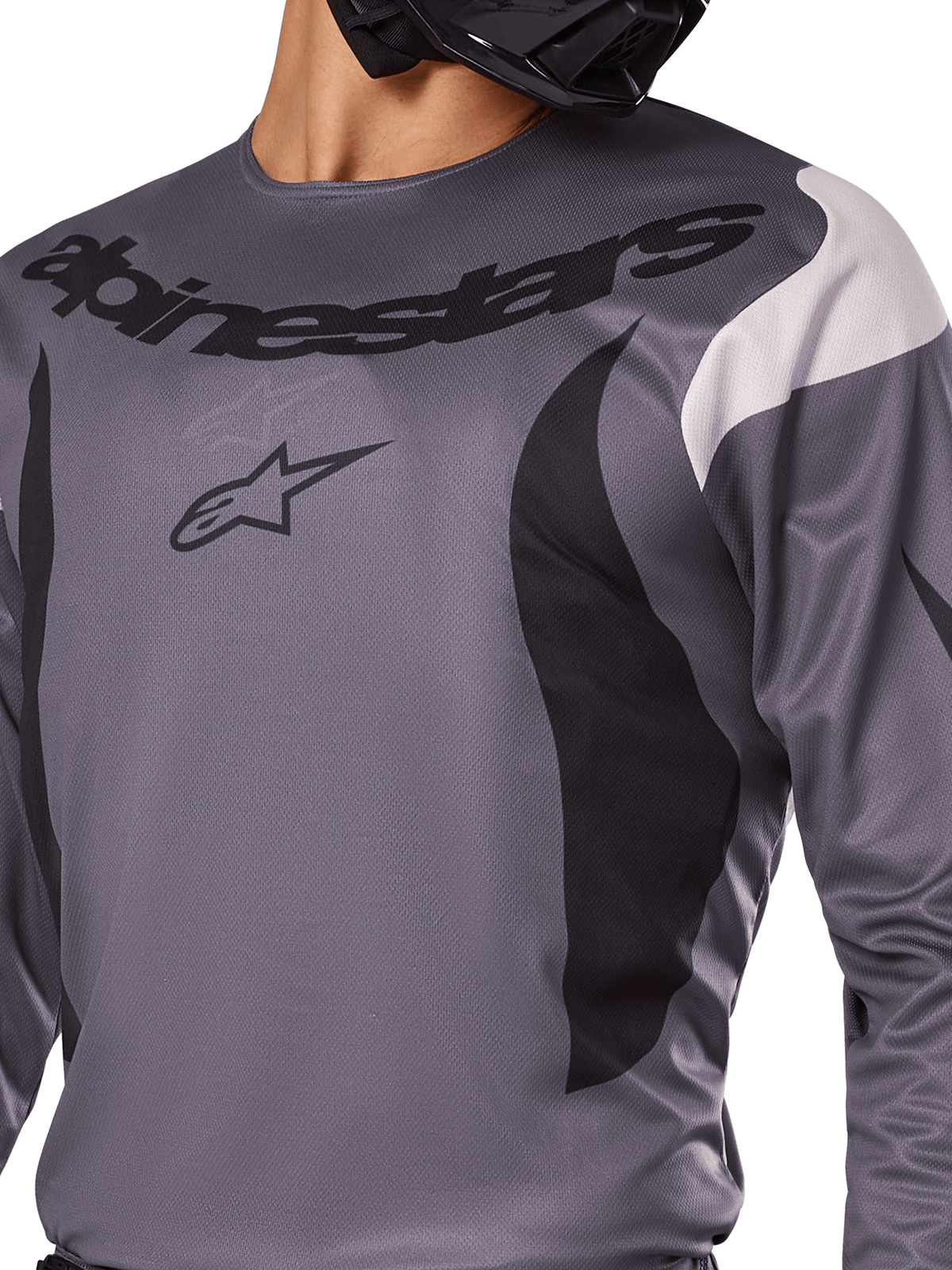Maillot Alpinestars Fluid Haul 2025, maillot de motocross, gris avec des accents noirs et blancs, arborant le logo et le lettrage Alpinestars sur la poitrine, coupe sportive pour la course tout-terrain.