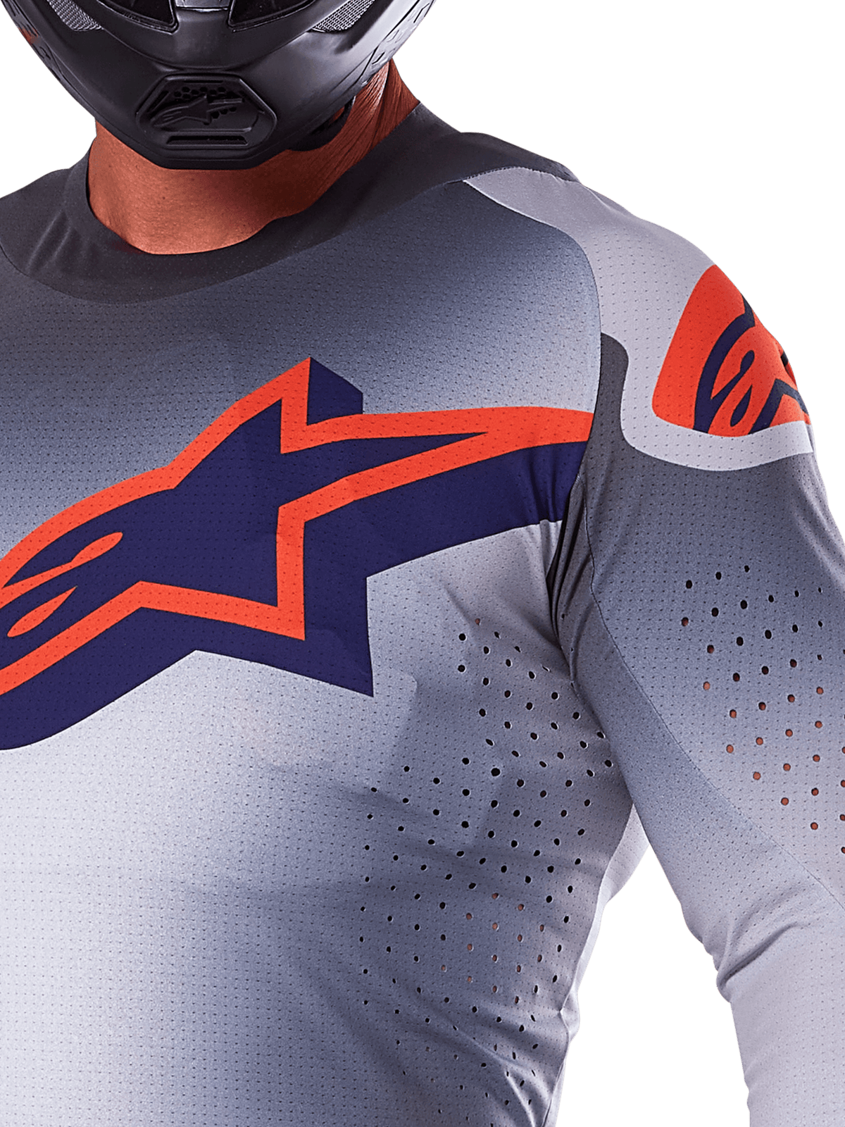 Alpinestars 2025 Supertech Lipan Jersey, Motocross Jersey, Gray Orange Fluo, featuring large navy and orange star logo on the chest, laser-cut perforations for airflow, lightweight mesh construction, worn with a black helmet