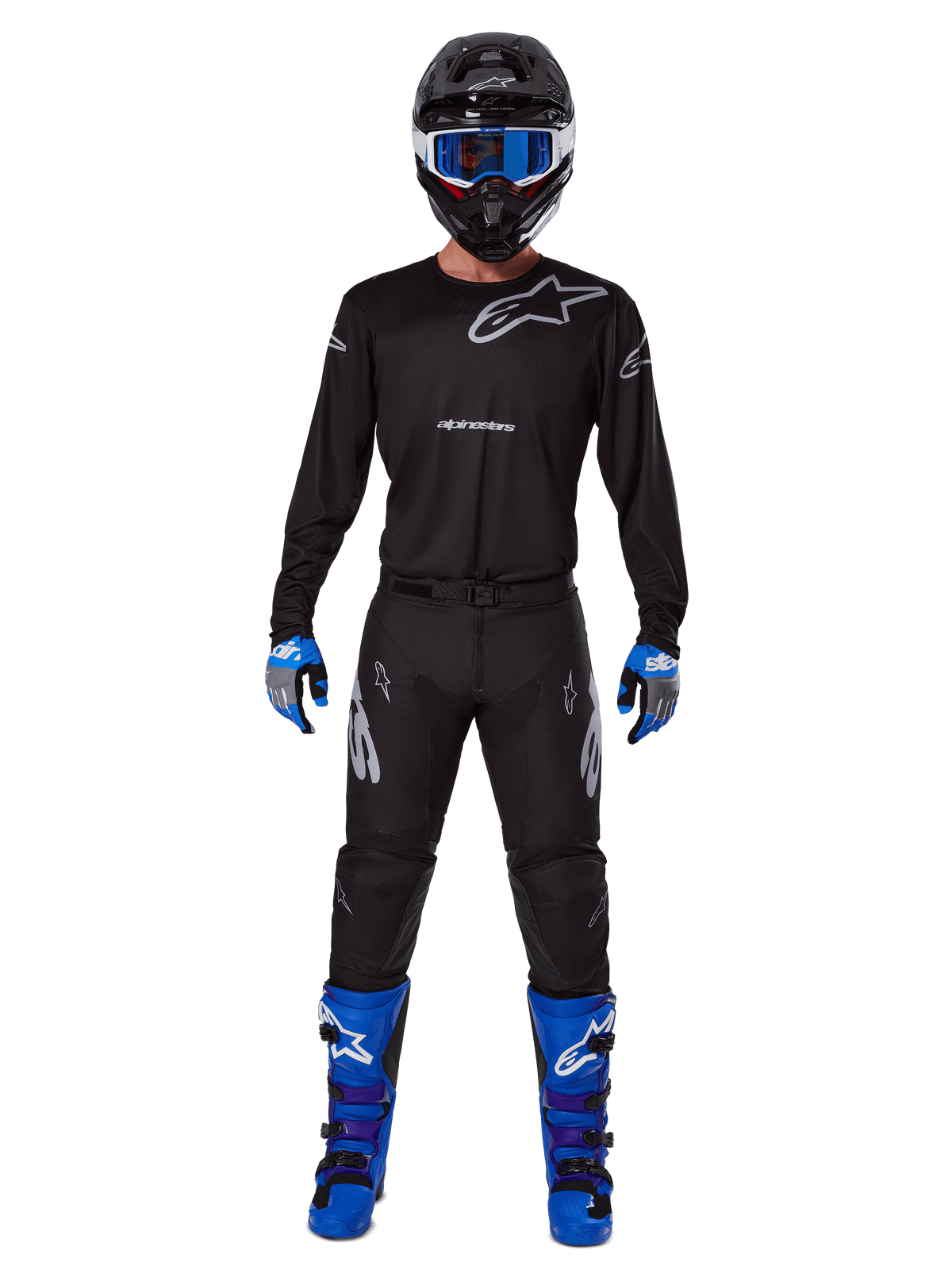 Alpinestars 2025 Racer Graphite Gear Set, Motocross rider wearing complete racing gear, black long-sleeve jersey with gray Alpinestars logos, black pants, black helmet with blue goggles, blue and gray gloves, blue and black boots, coordinated outfit for off-road motocross racing