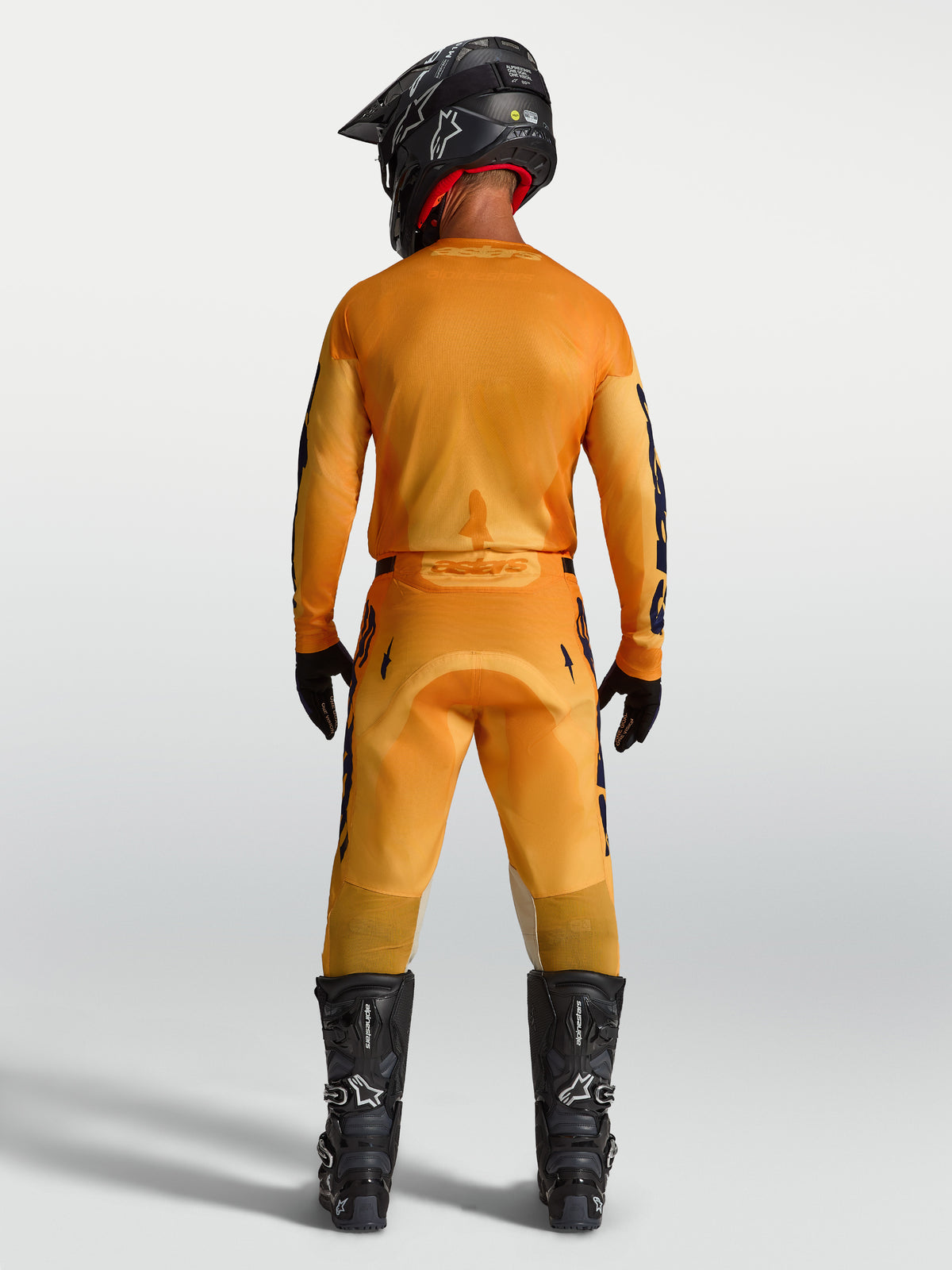 Alpinestars maillot et ensemble Racer Amber 2027, tenue de motocross pour homme, orange et bleu foncé, vue de dos.