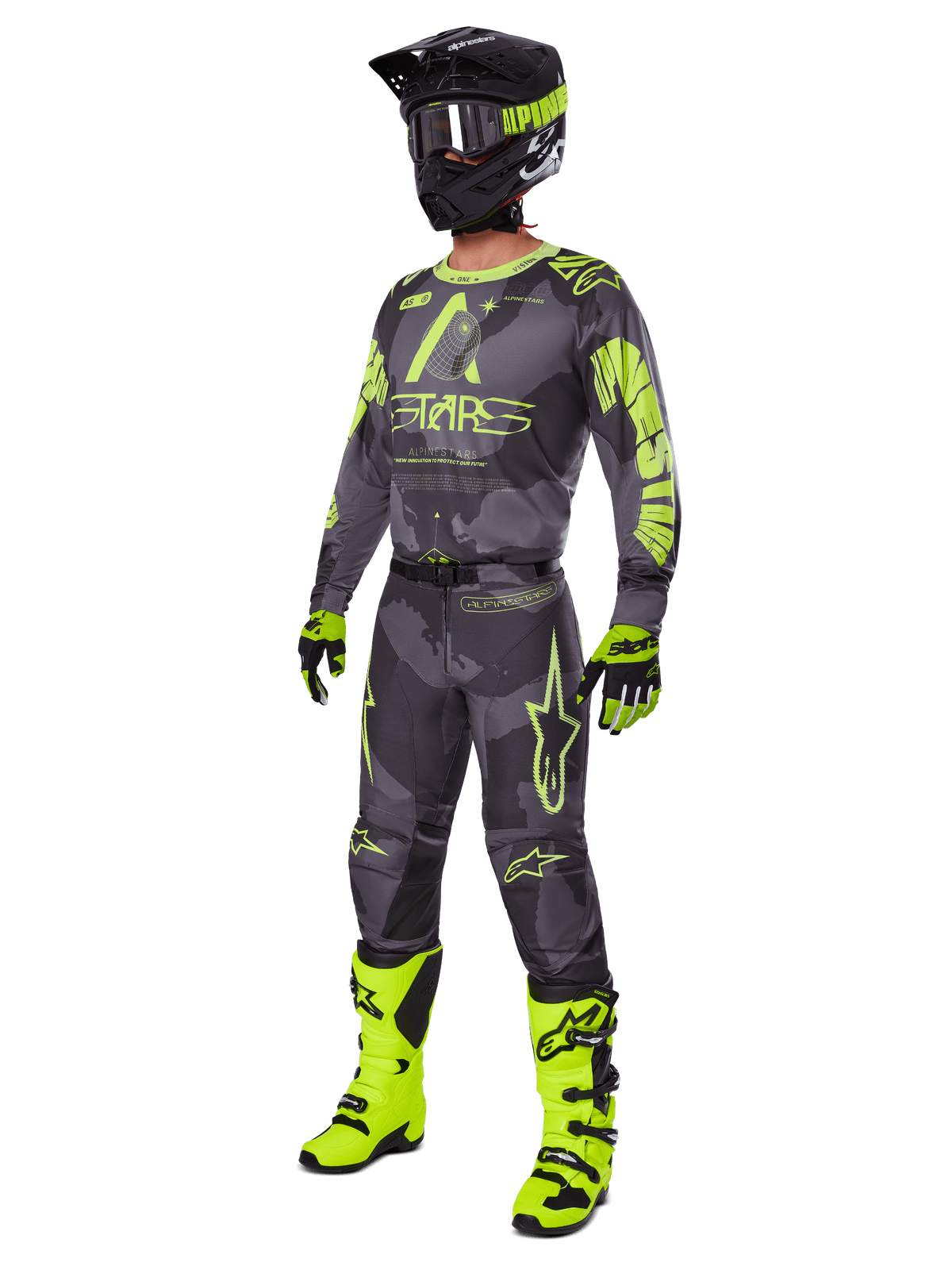 Motocross rider wearing the Alpinestars 2025 Racer Hollow gear set, Dark Camo and Yellow Fluo jersey and pants, black and fluo yellow helmet, matching gloves, and bright fluo yellow boots, coordinated outfit for off-road racing