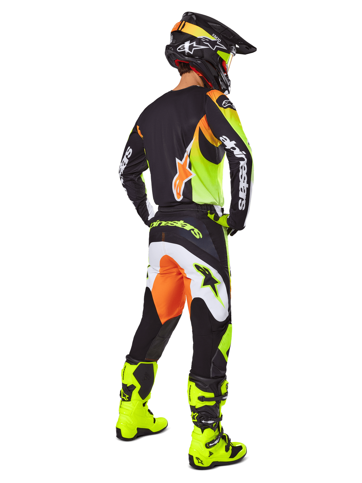 Alpinestars 2025 Fluid Wurx Gear Set, Motocross Jersey and Pants in Yellow, Black, and Orange, shown from a rear three-quarter view, paired with matching black helmet and bright yellow boots, professional off-road racing gear.