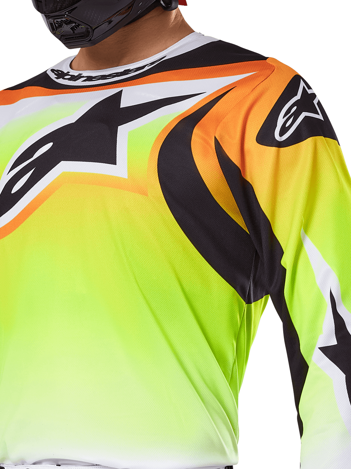 Alpinestars 2025 Fluid Wurx Jersey, Motocross Jersey, Fluorescent Yellow with Black and Orange graphics, featuring a large black Alpinestars logo on the chest and shoulder, worn by a rider with a black helmet.