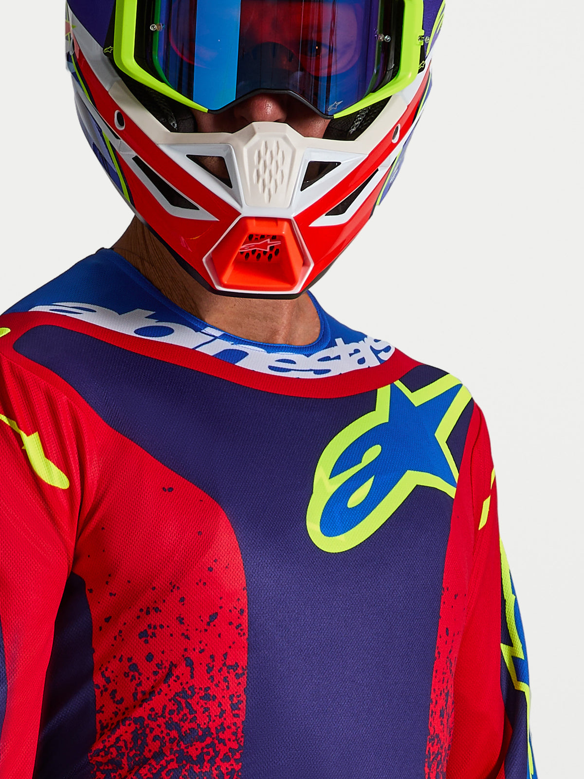 Maillot Fluid Drag Alpinestars, maillot de motocross pour homme, bleu marine et rouge feu, logo sur la poitrine et col sportif.