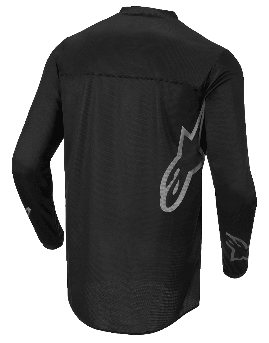Alpinestars Fluid Graphite Jersey, maillot de motocross, noir et gris foncé, vue arrière, arborant un grand logo Alpinestars gris sur le côté et des graphismes sur les manches, textile léger évacuant l'humidité pour la course tout-terrain