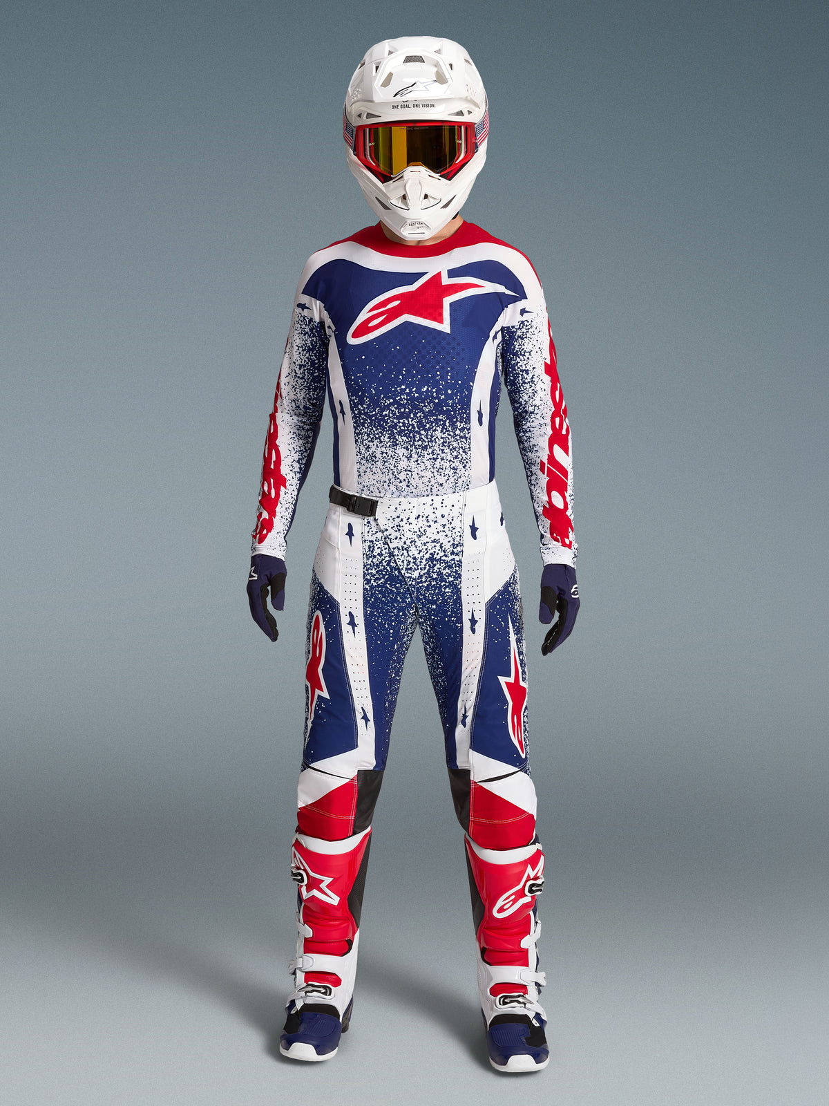 Alpinestars Techstar Unity Jersey, maillot de motocross rouge, blanc et bleu, graphismes mouchetés, édition limitée.