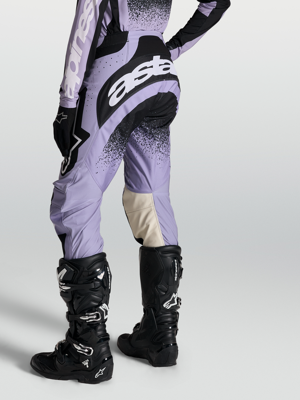 Alpinestars Stella Techstar Swan Pants, women's motocross performance gear in light violet and black, worn with Tech 7 boots.