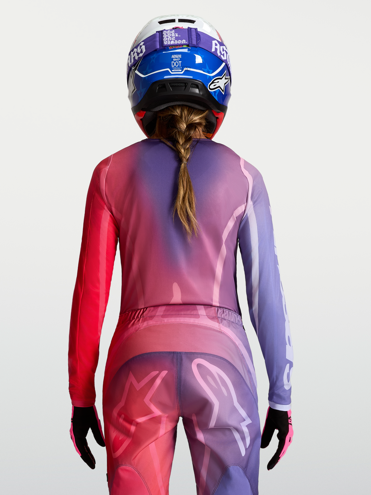 Maillot Alpinestars Stella Fluid Kepler, maillot de motocross pour femme, violet et rouge, vue de dos, poly-tissu respirant.