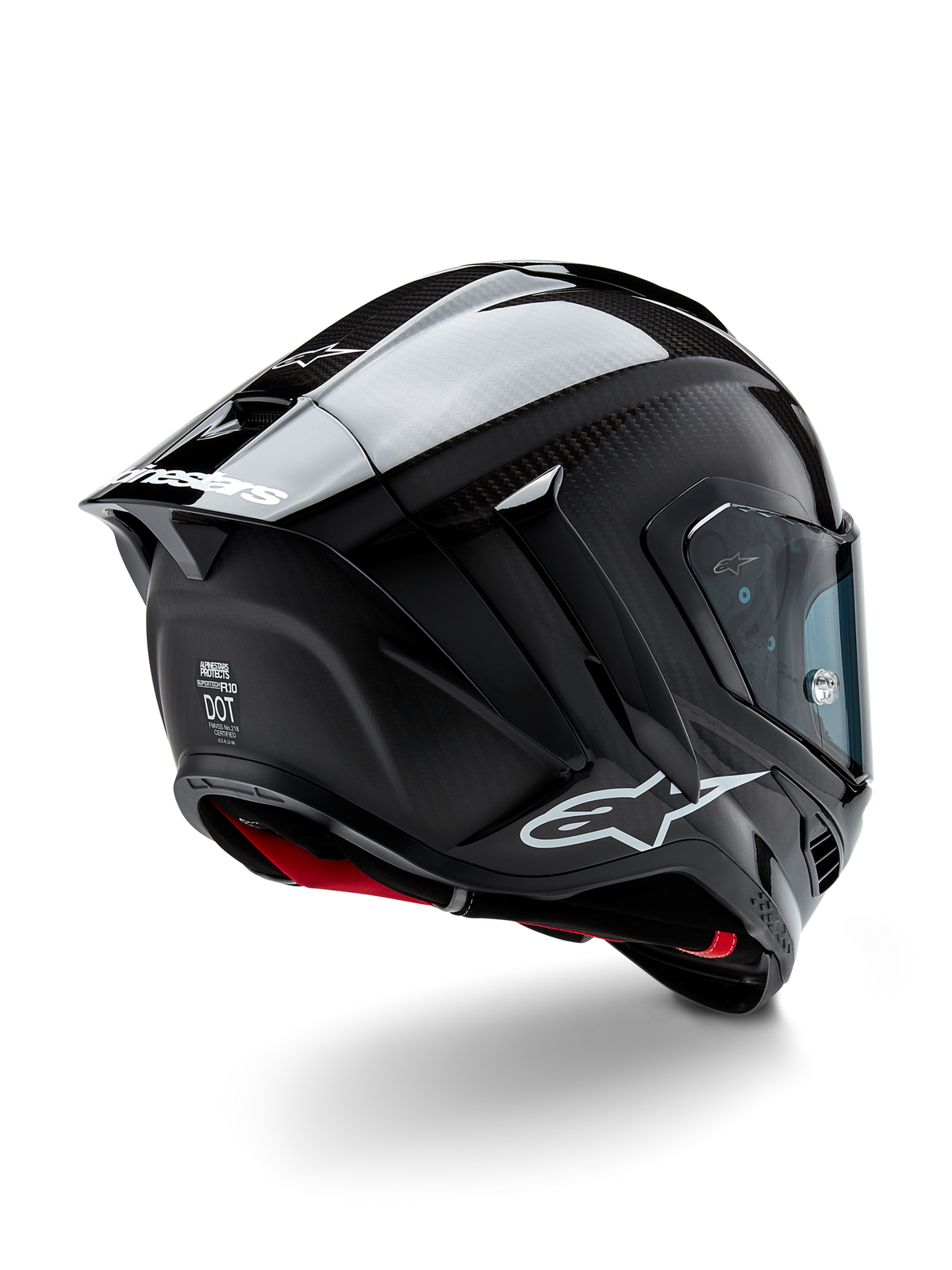 Casque Alpinestars Supertech R10 Solid, casque de course moto, finition carbone noir mat et brillant, vue de trois-quarts arrière montrant la coque en fibre de carbone, le spoiler aérodynamique et le logo Alpinestars.