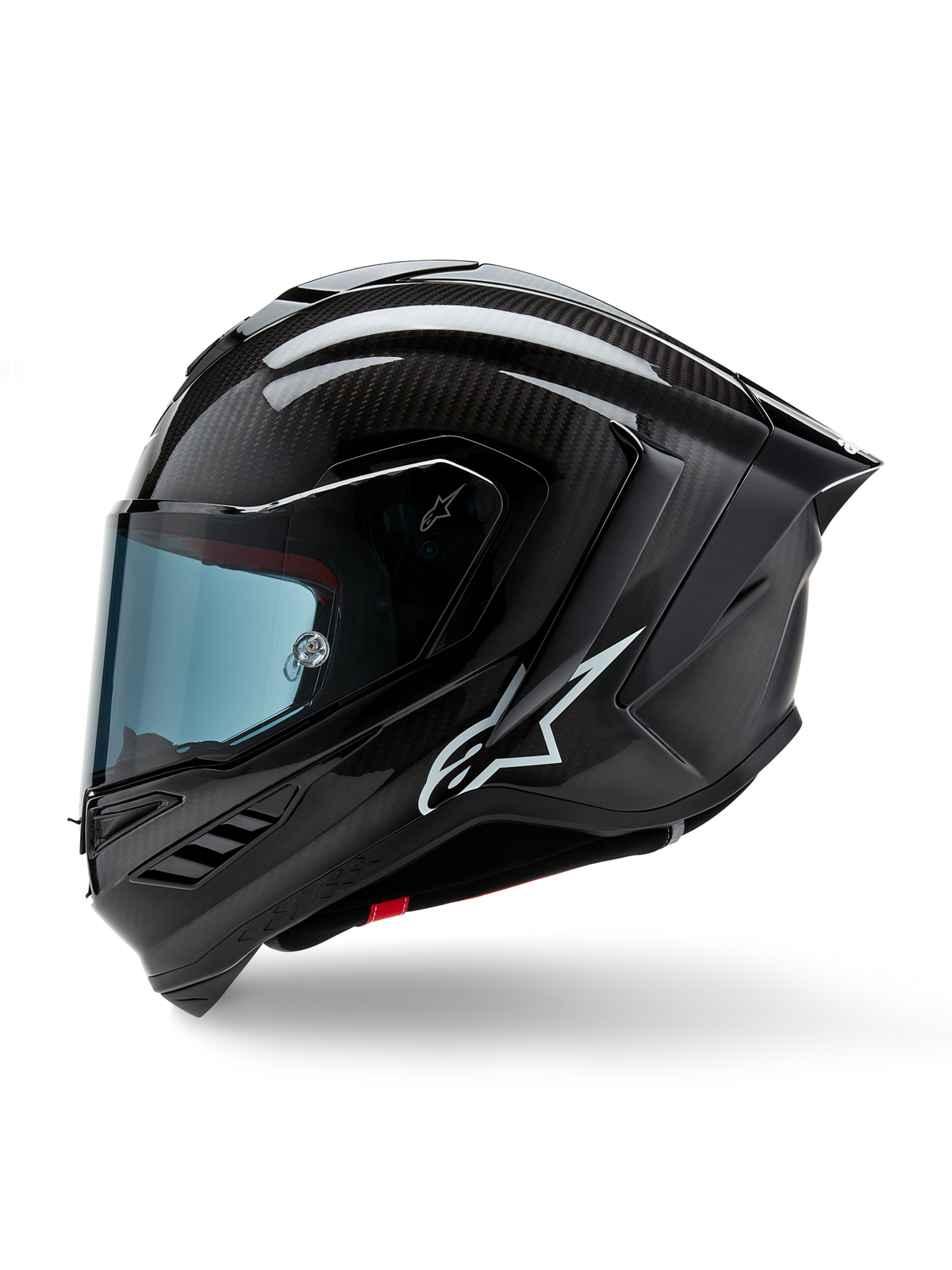 Casque Alpinestars Supertech R10 Solid, casque intégral de course de moto, carbone noir mat et brillant, motif de tissage en fibre de carbone visible, logo Alpinestars blanc sur le côté, design aérodynamique avec aileron arrière intégré et ports de ventilation, vue de profil