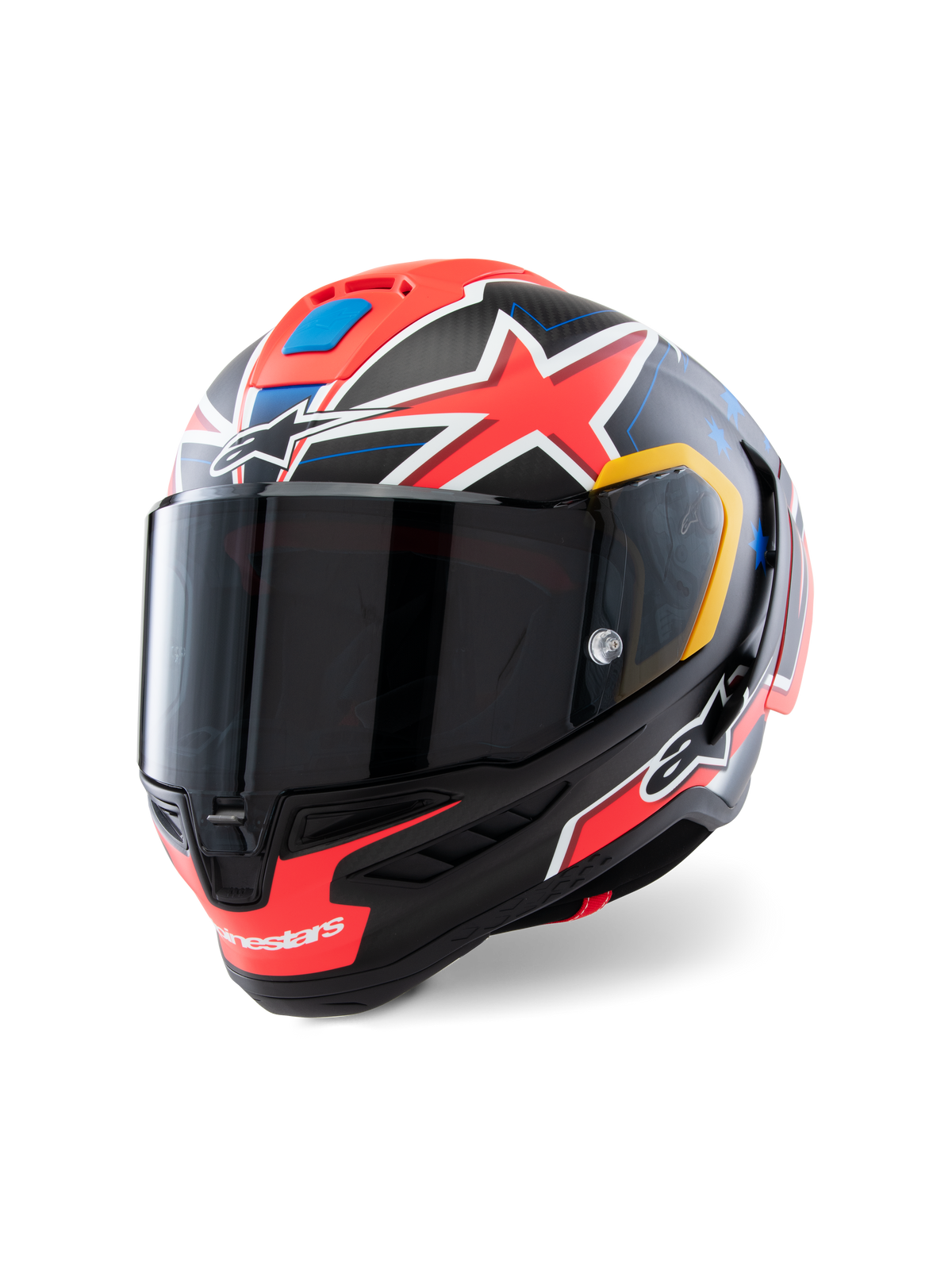 Casque Alpinestars Supertech R10 Miller Limited Edition, casque de course intégral, Carbone Rouge Mat avec étoiles rouges, accents bleus et jaunes, visière fumée foncée, coque en carbone aérodynamique pour la compétition moto professionnelle