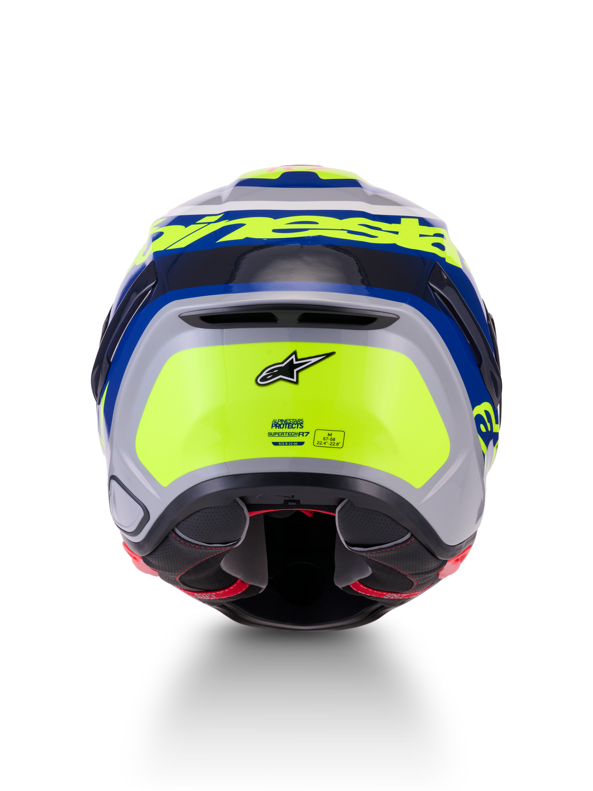 Alpinestars S-R7 Lumen, casque de moto racing ECE 22.06, vue arrière mettant en valeur le design aérodynamique, finition brillante argentée, bleue, rose et jaune avec marquage Alpinestars et détails de certification