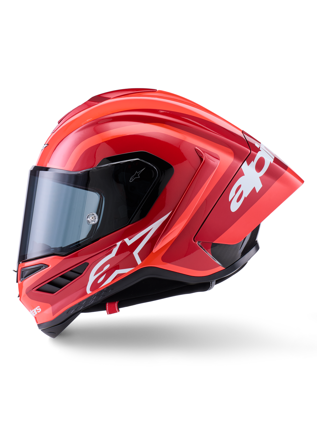 Casque Alpinestars Supertech R10 Arius, casque de course intégral, rouge brillant avec graphismes de logo blancs, vue de profil soulignant le spoiler aérodynamique et la visière transparente, coque en composite de fibre de carbone pour le sport motocycliste professionnel