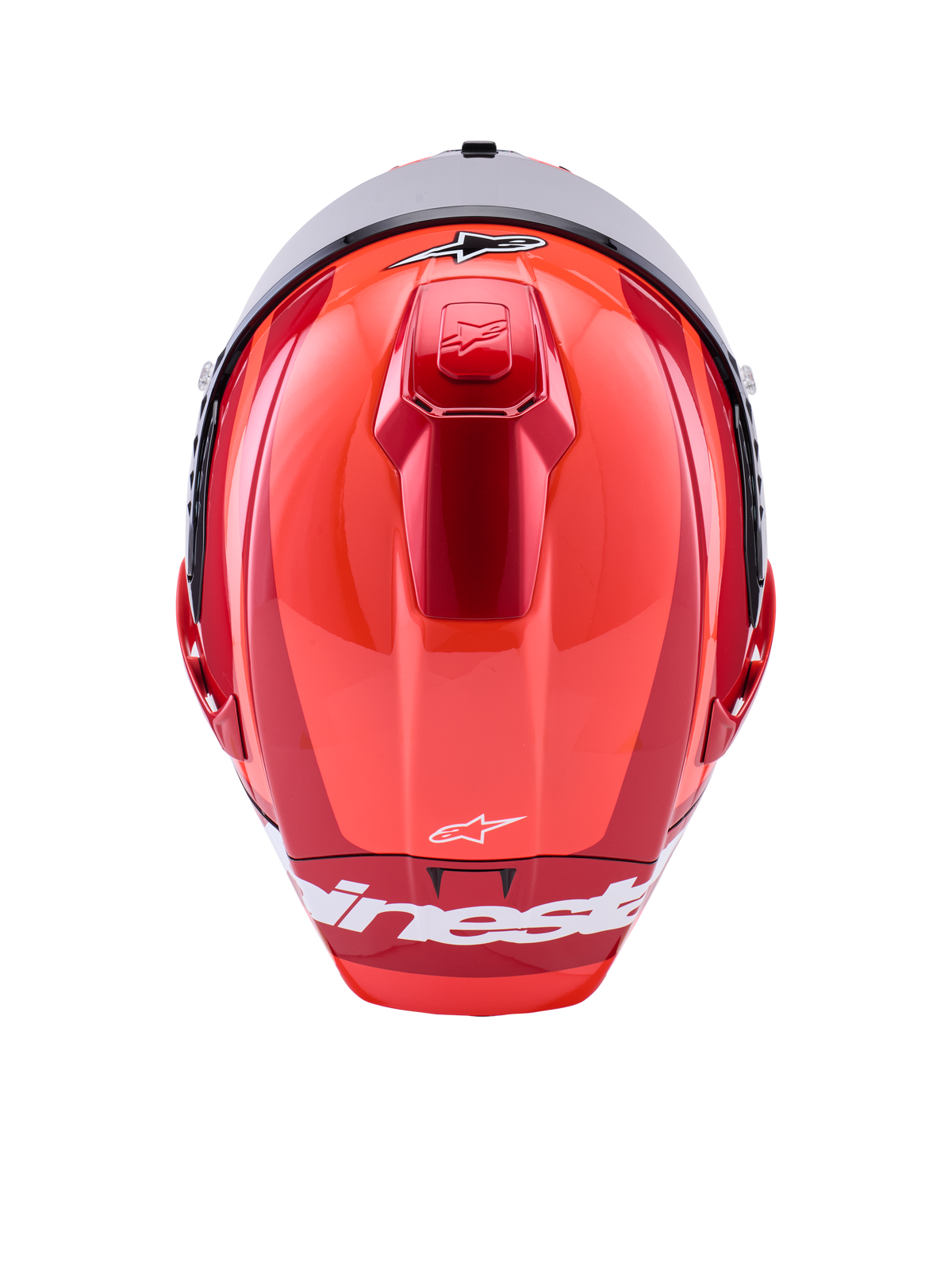 Casque Alpinestars Supertech R10 Arius, casque de course intégral, rouge brillant avec accents blancs, vue de dessus montrant les contours aérodynamiques de la coque, logo Alpinestars blanc et ventilation supérieure intégrée