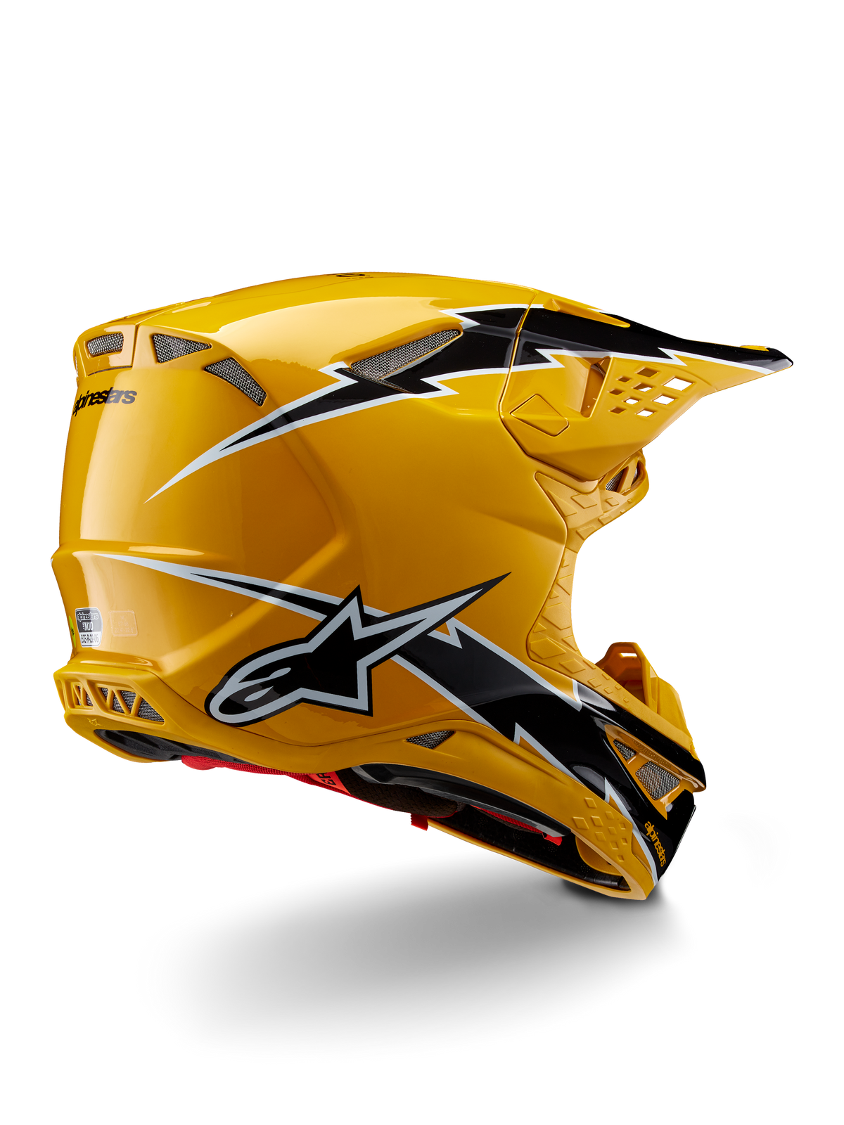 Casque Alpinestars Supertech M10 Ampress, casque de motocross, noir et jaune brillant, présentant une finition jaune brillante avec des graphismes noirs et blancs façon éclairs, vue de trois-quarts arrière montrant la coque aérodynamique et les orifices de ventilation intégrés.
