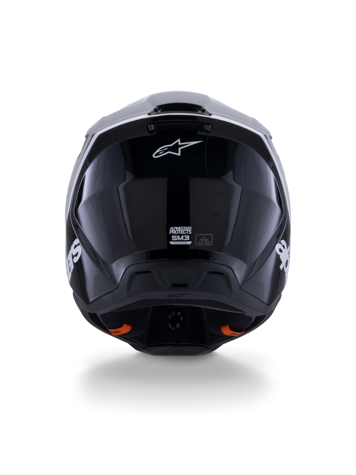 Casque Alpinestars S-M3 Radium ECE 22.06, casque de motocross, noir blanc gris brillant, vue arrière montrant la finition noire brillante, logo étoile Alpinestars, extracteurs d'air et étiquette de certification ECE.