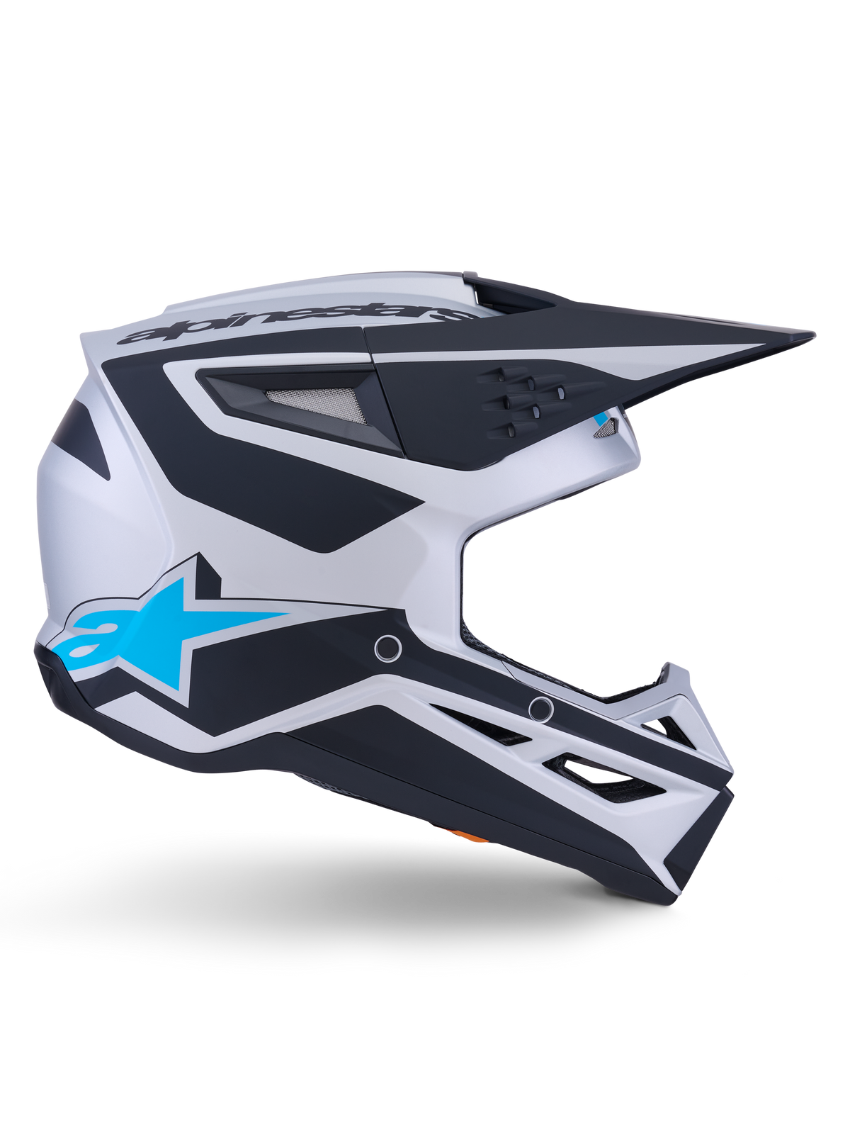 Casque de motocross Alpinestars S-M3 Heat ECE 22.06, argenté, bleu et noir mat, vue de profil avec graphismes noirs, logo A-star bleu vif, visière aérodynamique noire et multiples ports de ventilation pour la performance tout-terrain