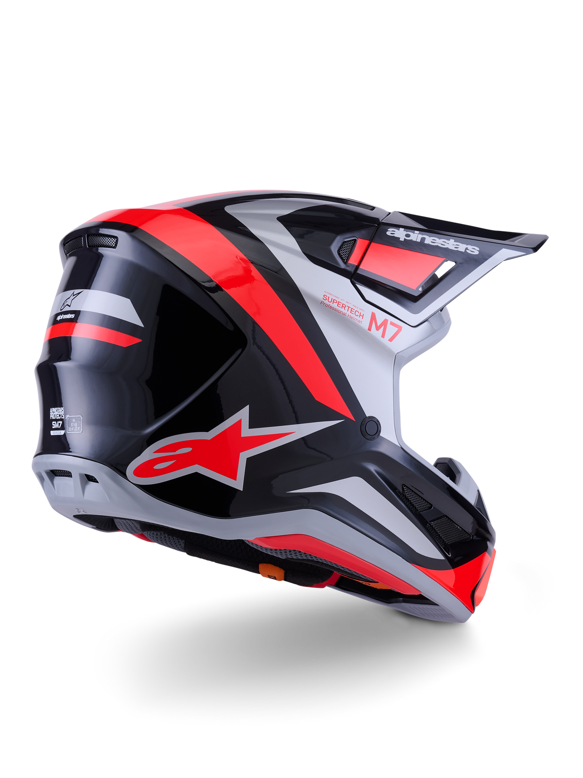 Casque Alpinestars S-M7 Rise, casque de motocross, noir, argent et rouge fluo brillant, vue de trois-quart arrière, doté d'un logo A-star rouge vif et d'accents argentés, coque aérodynamique avec visière, protection de course tout-terrain professionnelle