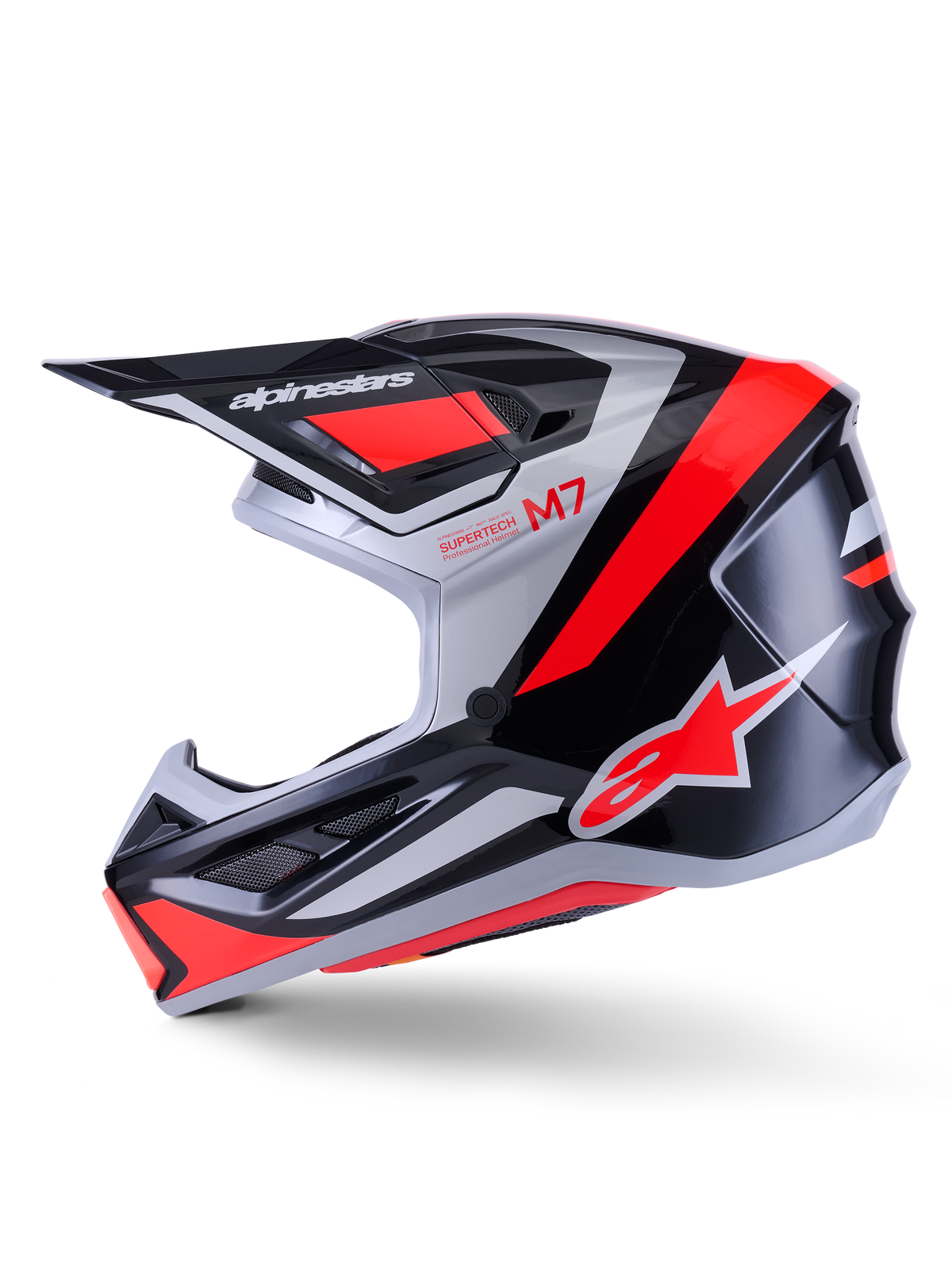 Casque Alpinestars S-M7 Rise, casque de motocross, noir, argent et rouge fluo brillant, vue de profil présentant une coque composite aérodynamique, une mentonnière ventilée et une visière proéminente avec le logo Alpinestars.