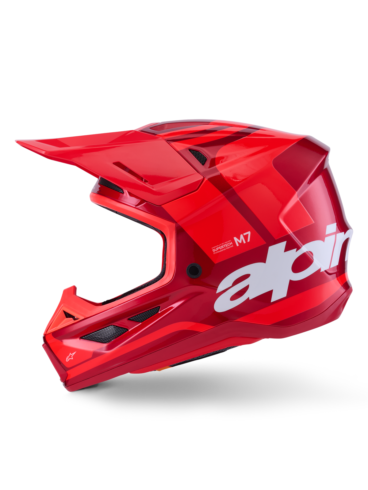 Casque Alpinestars S-M7 Core, rouge brillant avec accents géométriques, casque de motocross, vue de profil, coque aérodynamique avec ports de ventilation et logo blanc, équipement de course tout-terrain haute performance