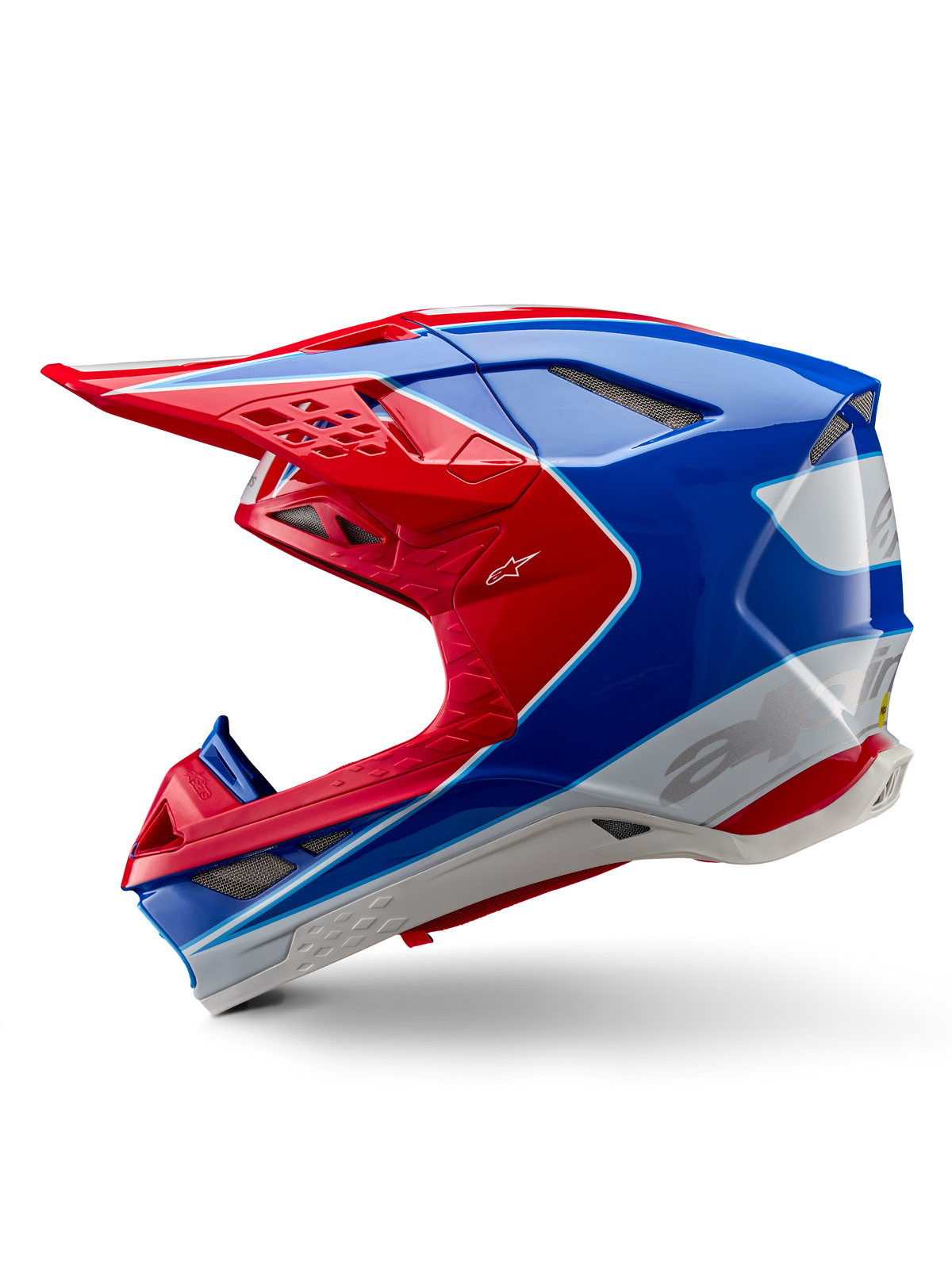 Casque Alpinestars Supertech M10 Aeon ECE 22.06, casque de motocross, rouge vif et bleu brillant, vue de profil, coque multi-composite aérodynamique avec orifices de ventilation intégrés et design graphique rouge et bleu, finition brillante pour la course tout-terrain