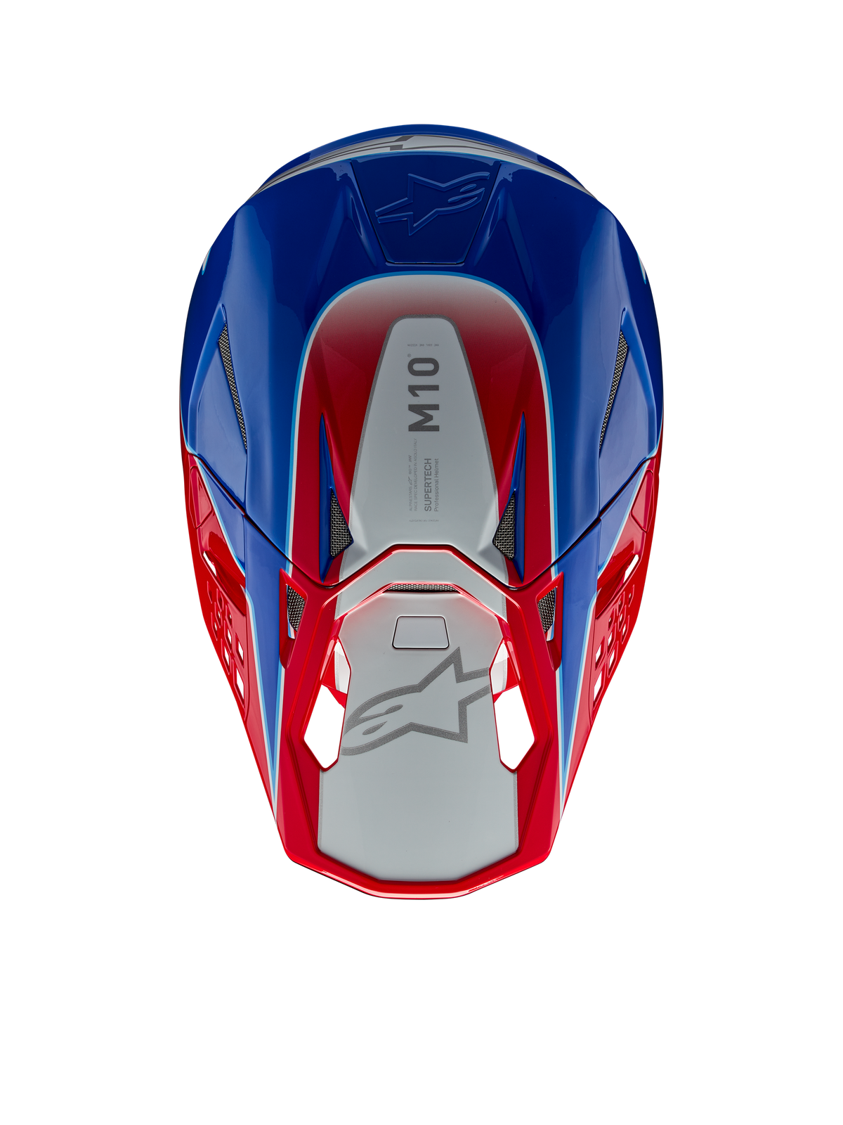Casque Alpinestars Supertech M10 Aeon, casque de motocross, rouge vif et bleu brillant, vue de dessus montrant le panneau central argenté avec marquage M10, coque aérodynamique avec accents rouges et bleus, grilles de ventilation en maille, protection de tête haute performance pour le motocross
