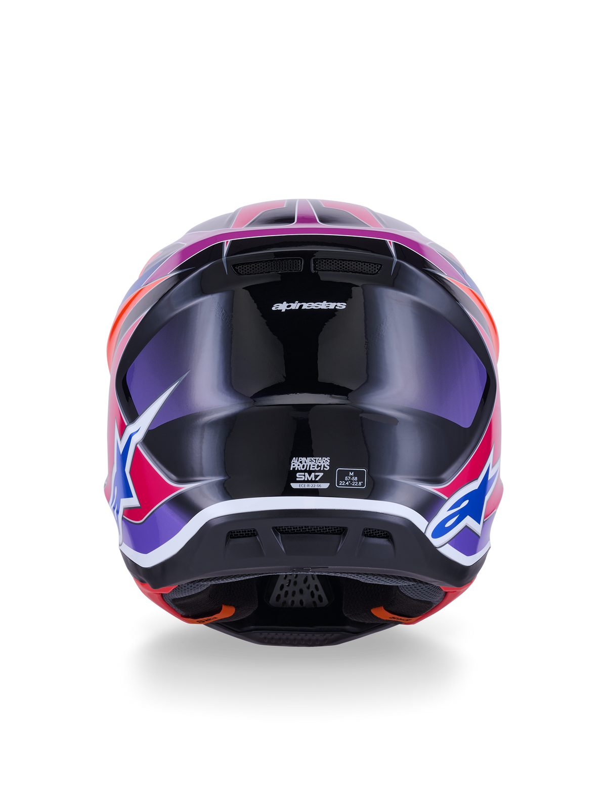 Casque Alpinestars S-M7 Fuse, casque de motocross, vue arrière, bleu, violet et rose brillant, graphismes rose et violet éclatants sur une coque noire brillante, avec ports de ventilation et étiquette de certification ECE 22.06