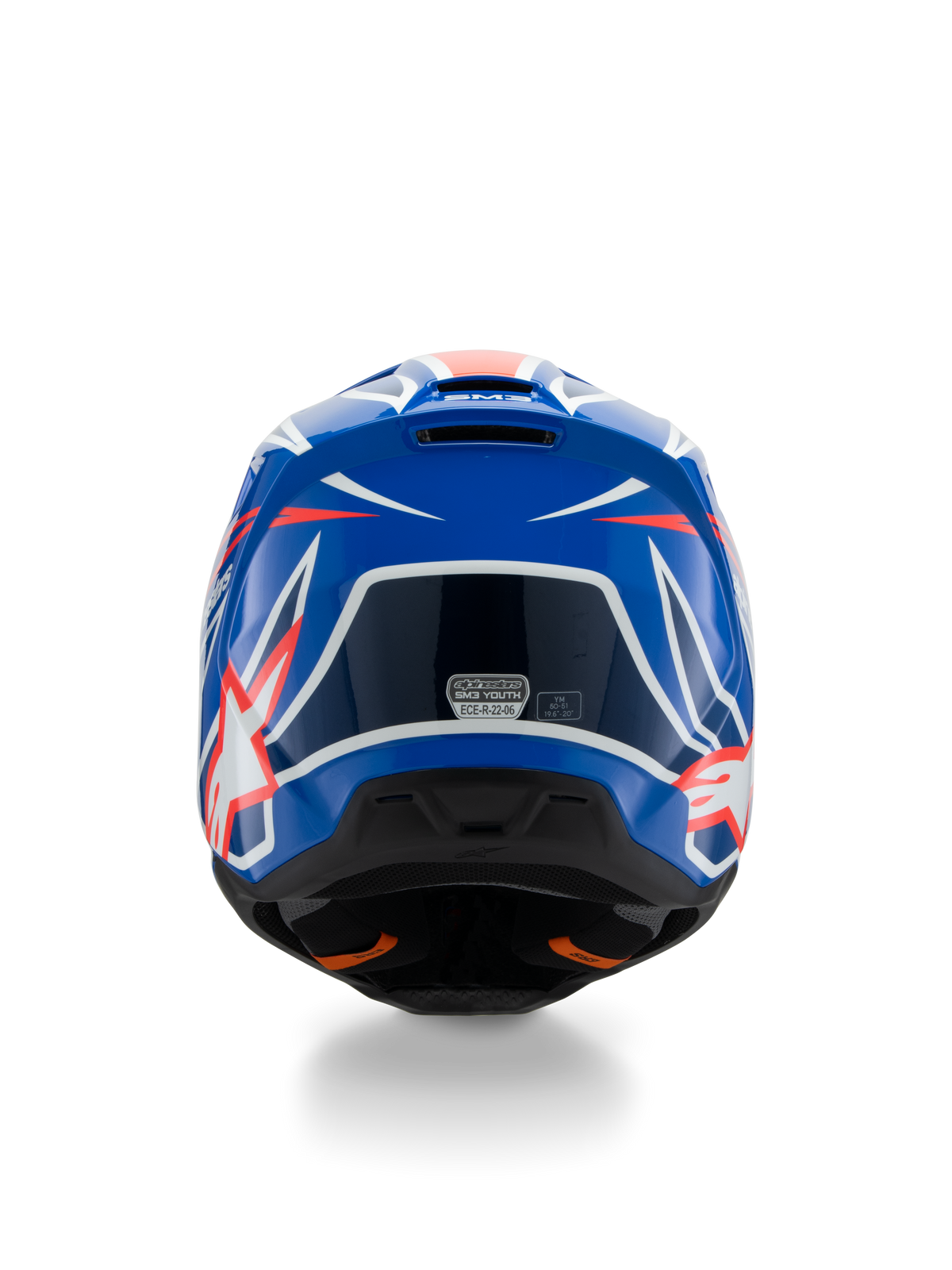 Casque Alpinestars S-M3 Youth Wurx ECE 22.06, casque de motocross, bleu, rouge et blanc, vue arrière montrant le design aérodynamique avec des extracteurs d'air, finition brillante avec des accents graphiques vifs et autocollant de certification de sécurité.