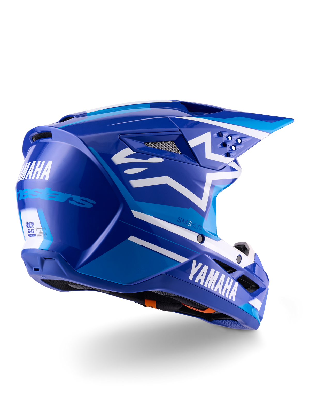 Casque Alpinestars Yamaha S-M3 ECE 22.06, casque de motocross, bleu et blanc brillant, avec logos Yamaha et Alpinestars, logo étoile blanche sur le côté, multiples aérations d'entrée et d'extraction d'air, design aérodynamique pour la performance tout-terrain