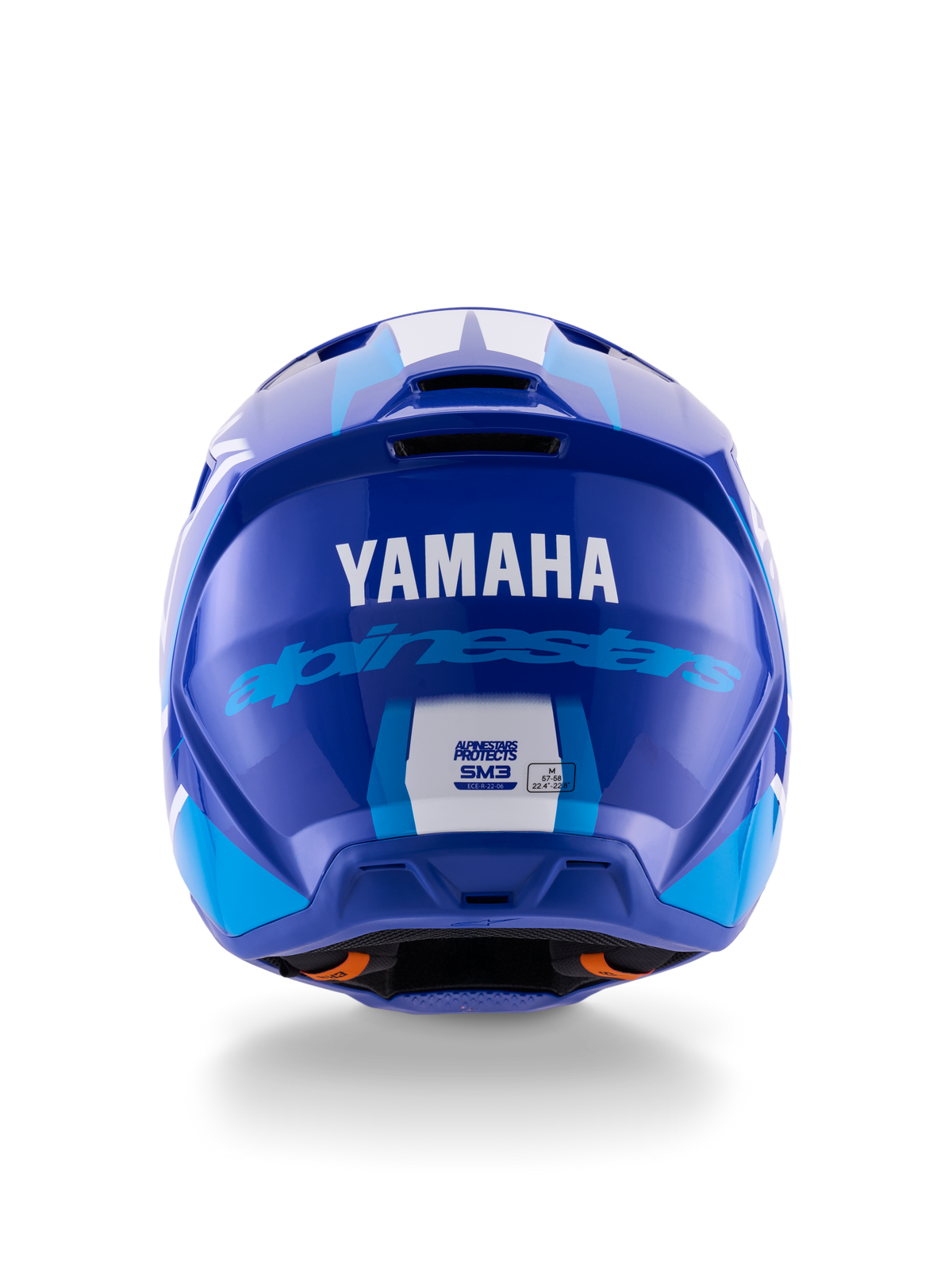 Casque Alpinestars Yamaha S-M3, casque de motocross, bleu et blanc brillant, vue arrière montrant le logo YAMAHA blanc et l'inscription Alpinestars bleue, finition brillante élégante avec ports de ventilation et étiquettes de certification de sécurité.