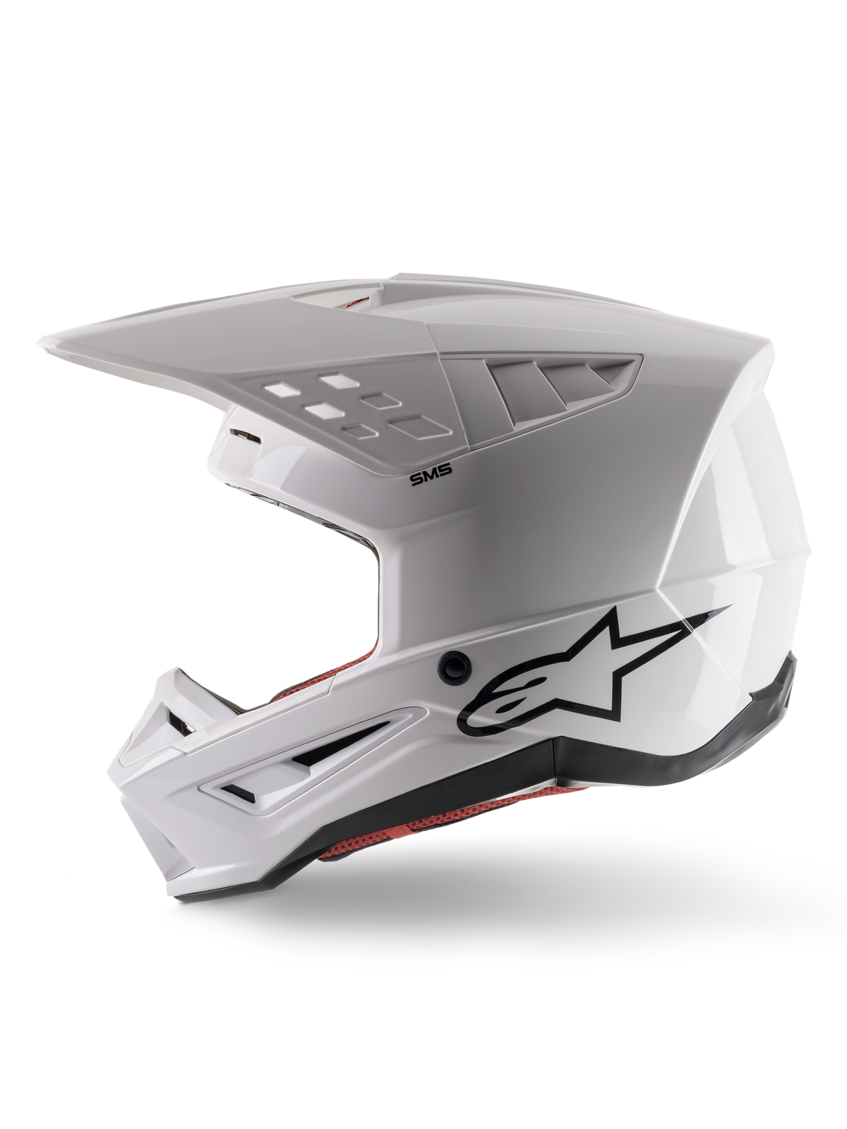 Alpinestars S-M5 Solid Helmet ECE 22.06, casque de motocross, blanc brillant, vue de profil avec design de coque angulaire, logo Alpinestars noir sur le côté, multiples orifices de ventilation et visière intégrée pour la course tout-terrain.