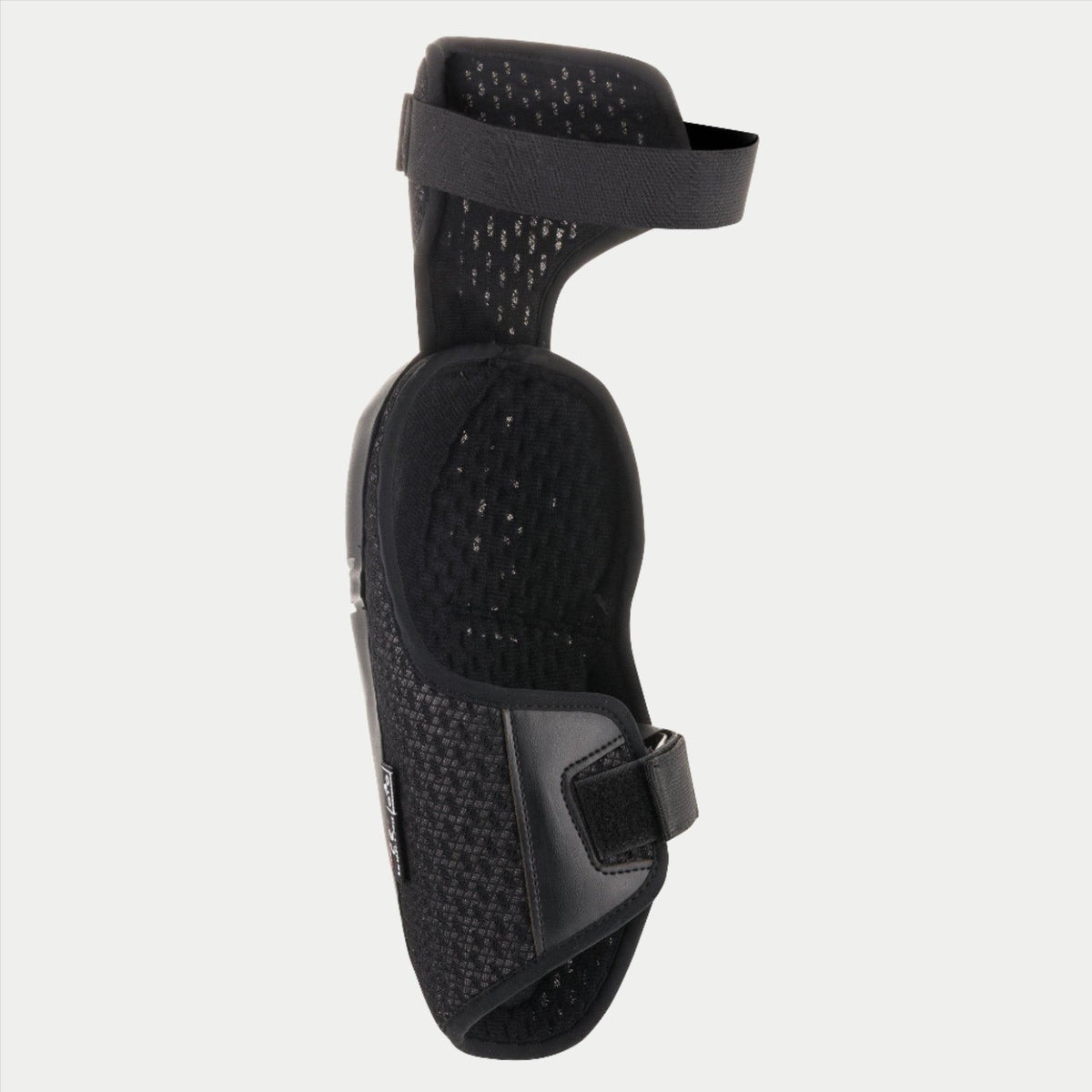 Alpinestars Youth Bionic Plus Knee Protector, noir, illustrant la doublure intérieure en mesh et le système de fermeture à double sangle, conception ergonomique pour la protection motocross tout-terrain
