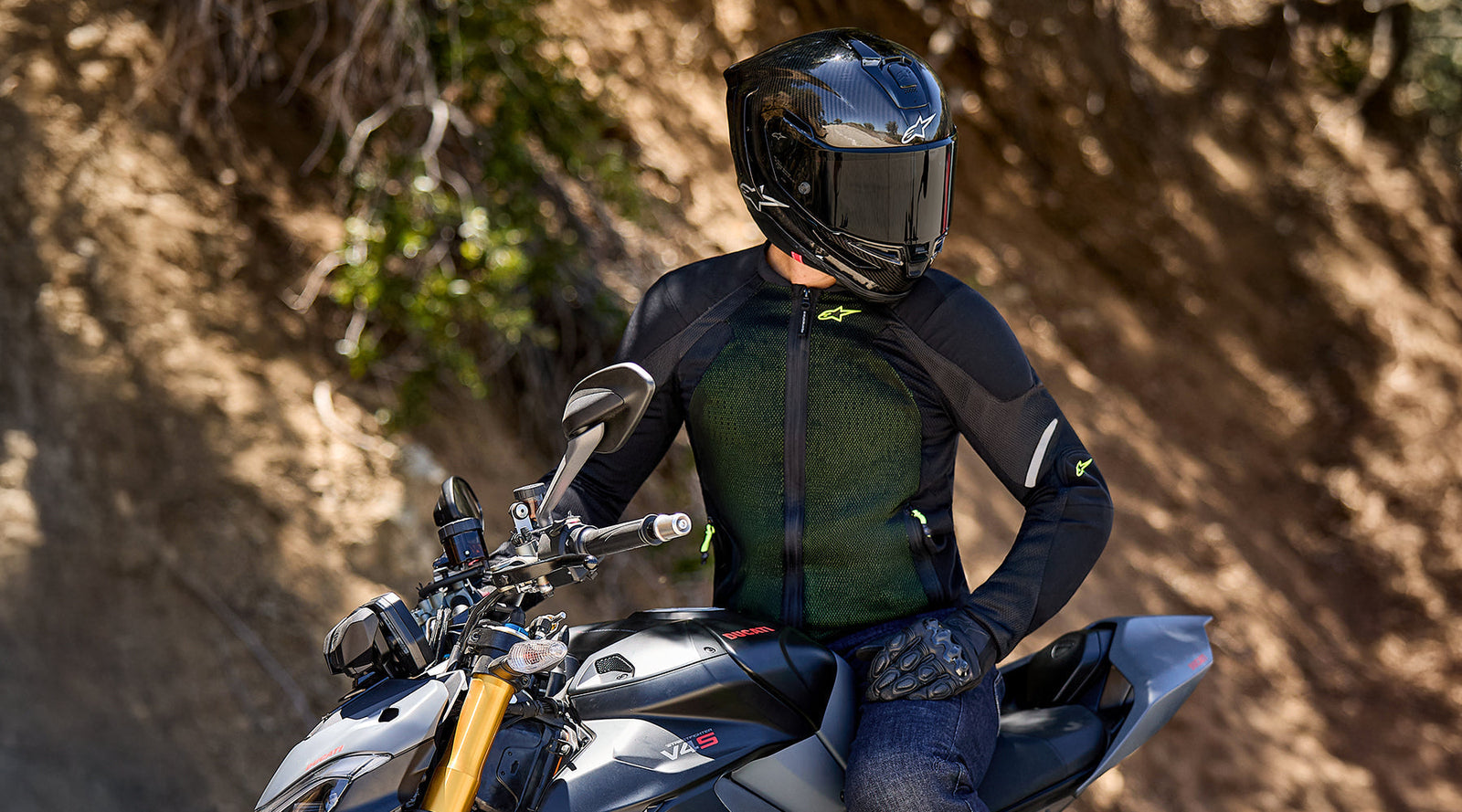 Motorcycle rider wearing the Alpinestars Troop Air Pro jacket in the green version