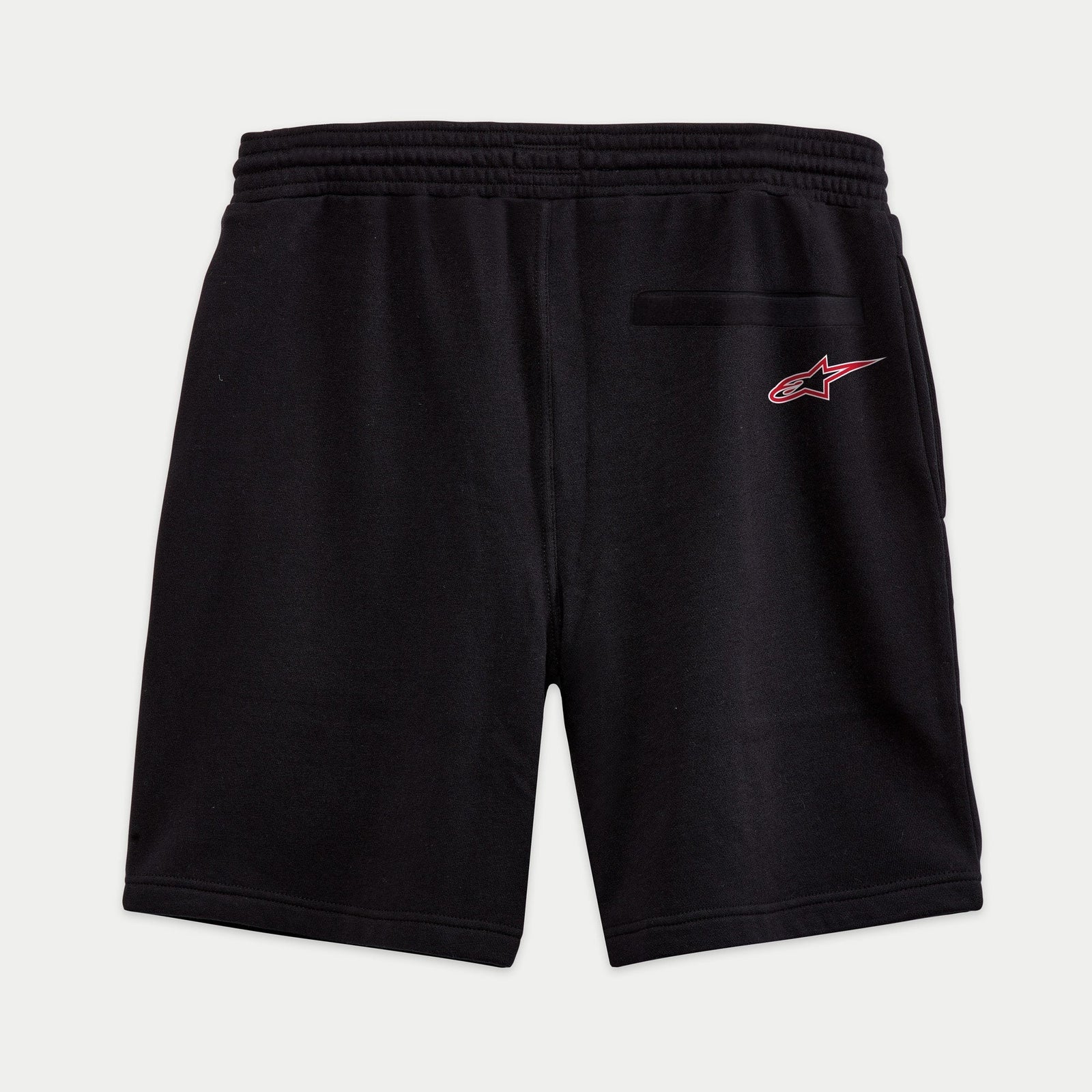 Alpinestars Dunker Short, short d'entraînement en polaire noir, vue arrière montrant la poche passepoilée et le logo Ageless rouge sur la hanche, taille élastique.