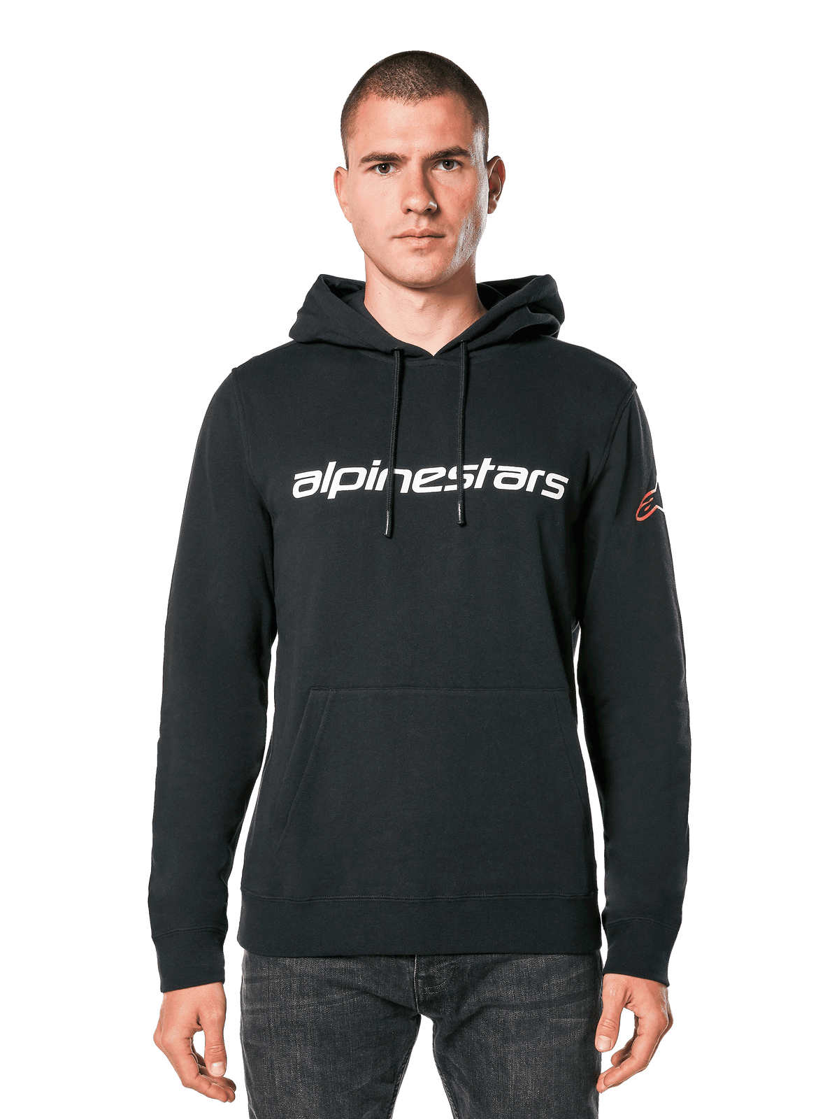 Alpinestars Linear Wordmark V3 Hoodie, Black Pullover Hoodie, White Alpinestars wordmark on chest, Red Ageless sleeve logo, front kangaroo pocket, drawstring hood, worn by a male model, casual motorsport-inspired streetwear