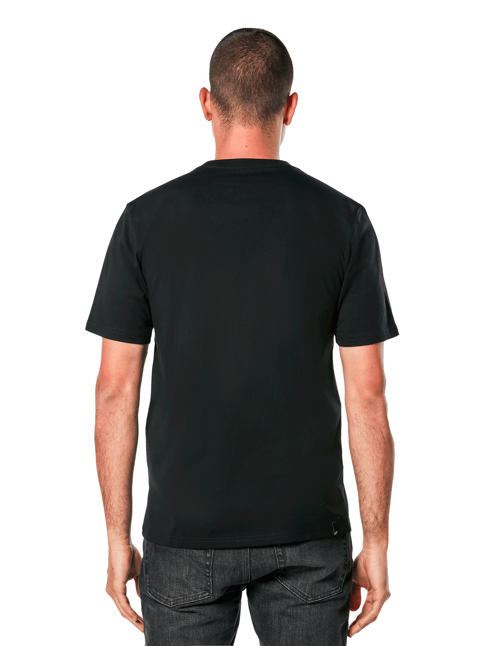 A person stands facing forward, wearing the Alpinestars Ride 4.0 Camo CSF Tee. The black T-shirt features a soft hand print with a colorful graphic logo and the word "RIDE" beneath. The person has short hair and a neutral expression. The background is plain black.