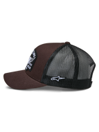 Casquette Trucker Heritage Patch Alpinestars, marron et noir, vue de profil montrant le devant en sergé marron et l'arrière en maille noire, patch logo Ageless blanc sur le côté, couronne structurée et visière courbée