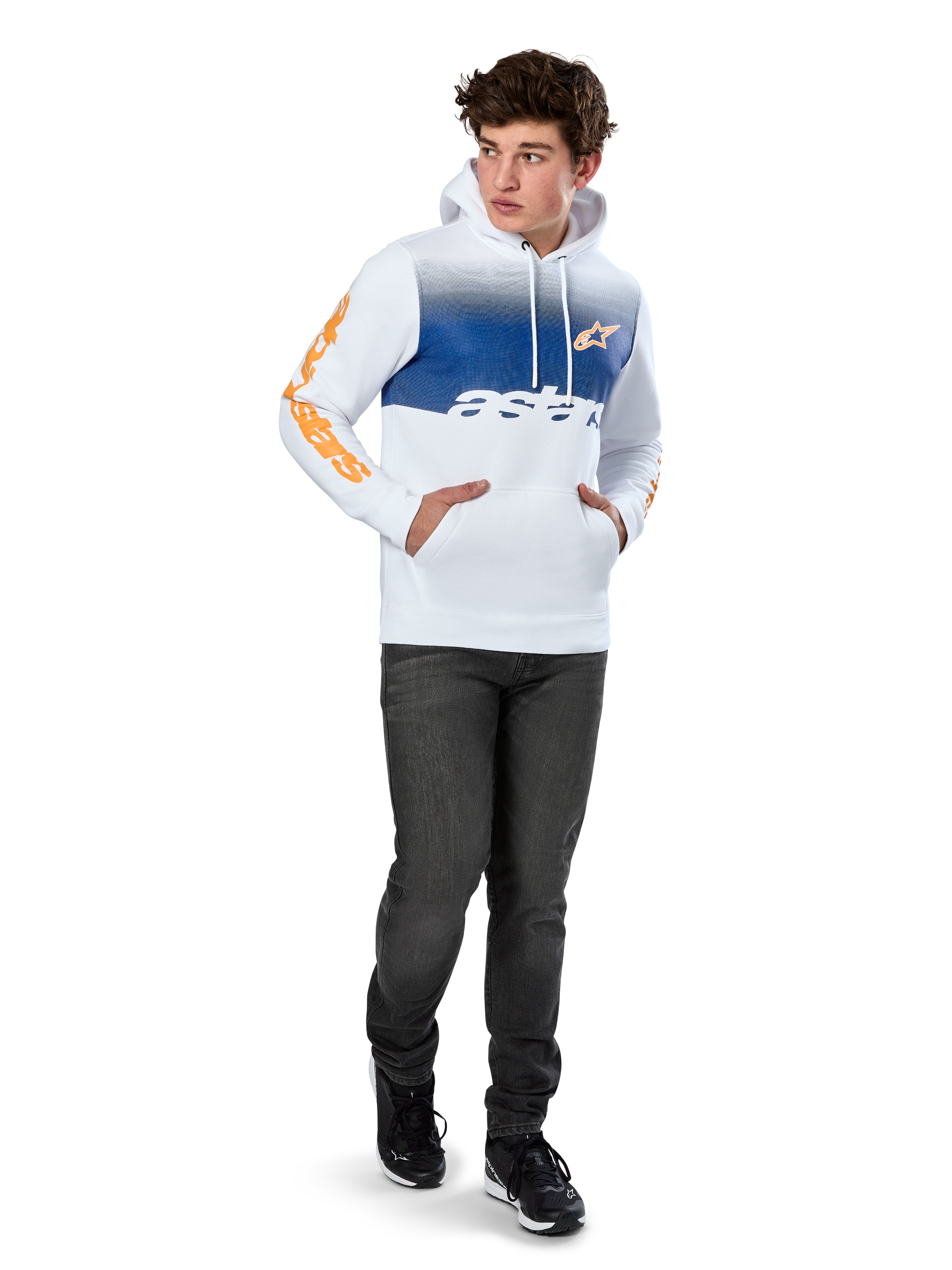 Alpinestars Specter Hoodie, White pullover fleece with blue gradation fade print, orange HD front logo and sleeve wordmarks, featuring a kangaroo pocket and drawstring hood, worn with dark jeans for a casual motorsport-inspired look