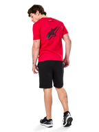 Alpinestars Formulate Csf Tee, Short Sleeve T-Shirt, Red, Large black perforated Astars logo on the back, worn with black shorts and sneakers, casual motorsport-inspired streetwear