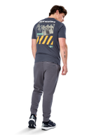 Alpinestars No Barrier CSF Tee, Short Sleeve T-Shirt, Charcoal, Back view featuring large distressed photo graphic with yellow diagonal stripes and white logo, casual motorsport-inspired streetwear