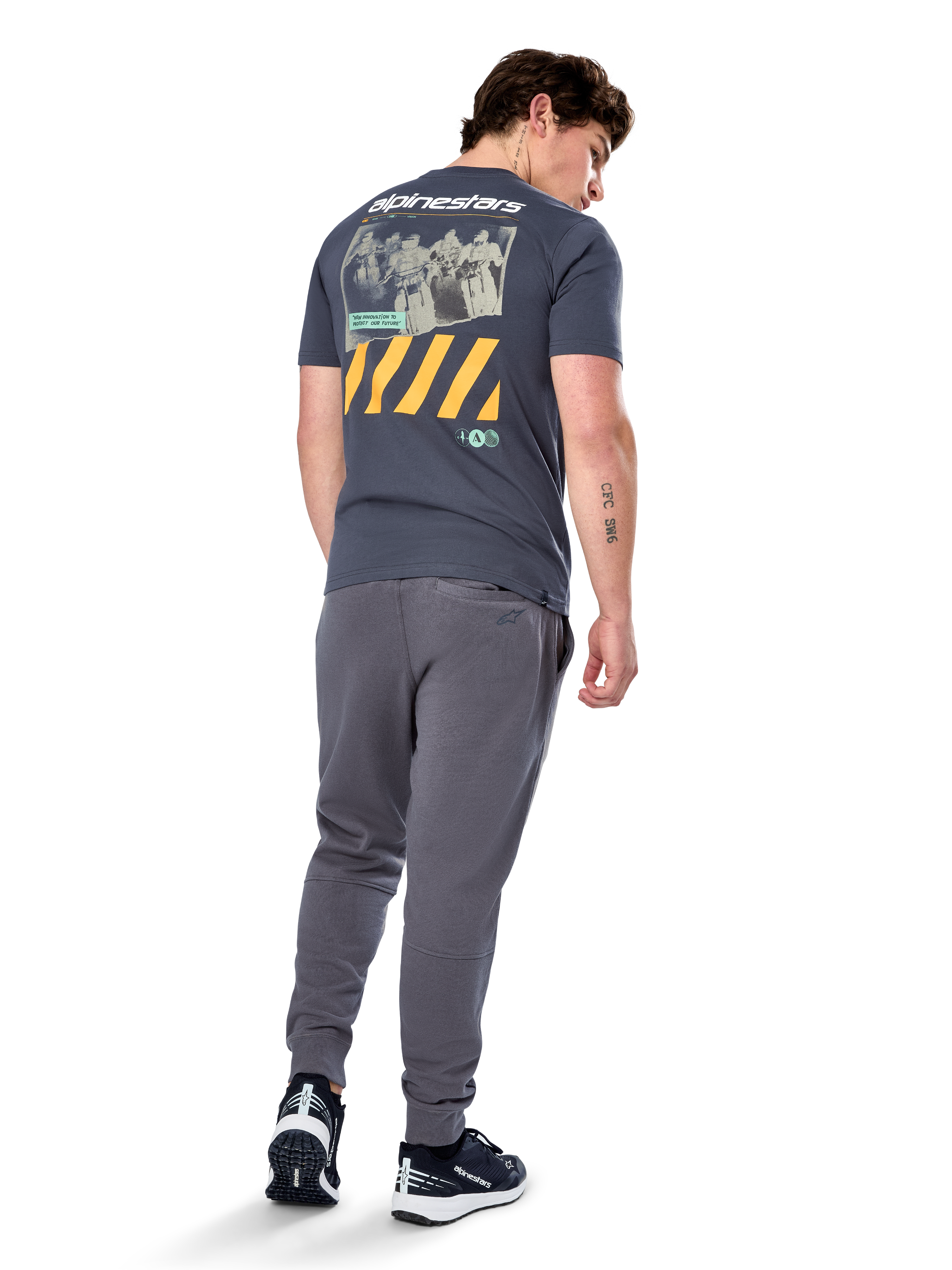 Alpinestars No Barrier CSF Tee, Short Sleeve T-Shirt, Charcoal, Back view featuring large distressed photo graphic with yellow diagonal stripes and white logo, casual motorsport-inspired streetwear