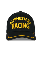 Casquette Alpinestars Luminary, casquette snapback noire, broderie Alpinestars Racing 3D jaune à l'avant, visière incurvée avec liseré sutache jaune, accessoire de sport automobile décontracté