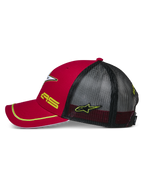 Alpinestars Exceed Trucker Hat, Red and Black side view, curved bill with yellow piping, black mesh back panels, yellow AS and star logo embroidery, casual motorsport-inspired headwear