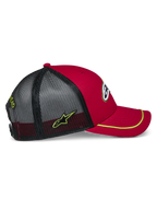 Alpinestars Exceed Trucker Hat, Red and Black with Neon Yellow accents, featuring a curved bill with neon yellow sutache trim, red structured crown, and black mesh back with embroidered side logo, casual motorsport style