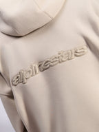 Sweat à capuche Oversized Emergent Alpinestars, streetwear décontracté, sable, vue détaillée du logo Alpinestars brodé en 3D ton sur ton au dos, texture en polaire premium