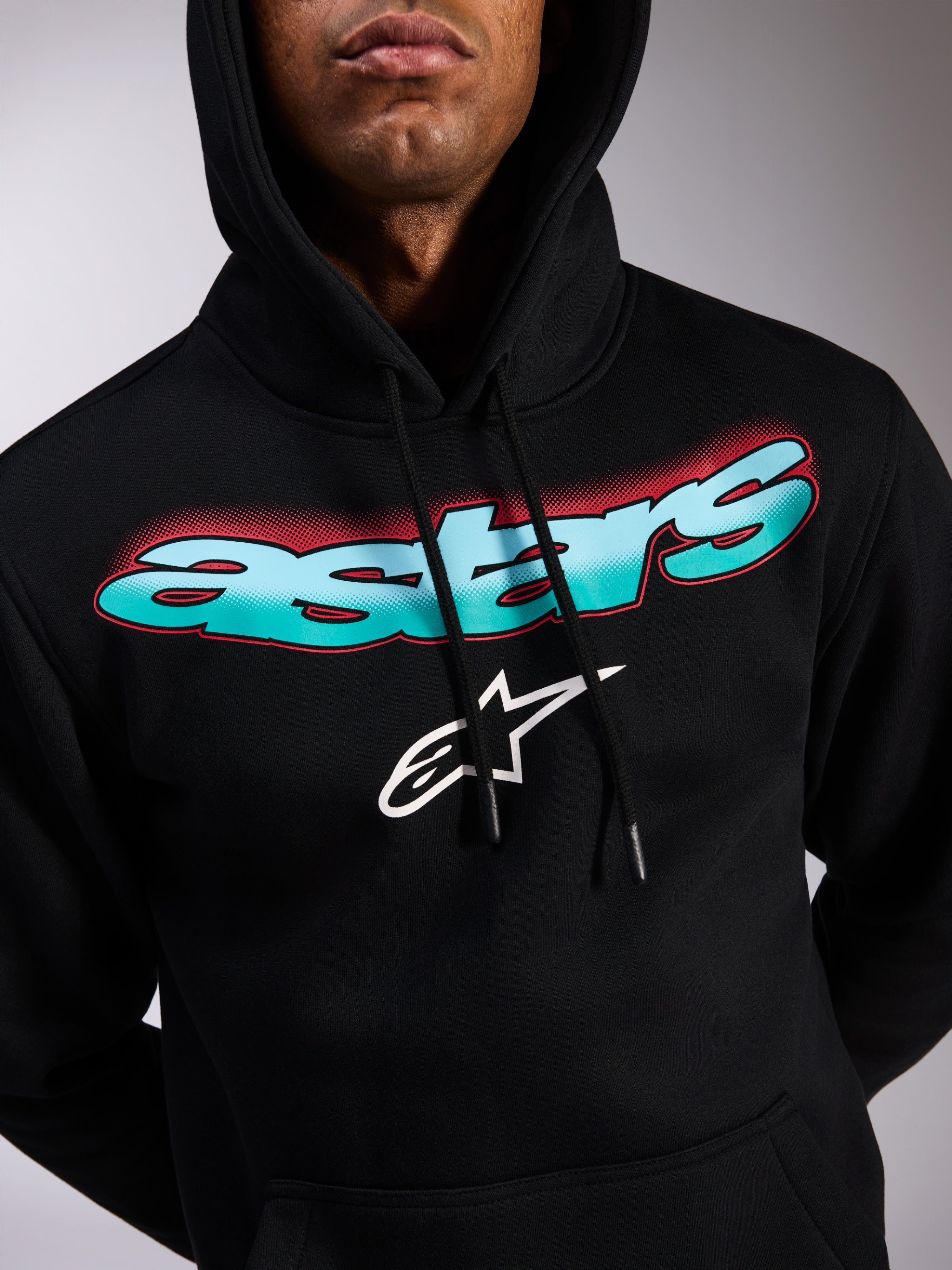 Alpinestars Ellipsoid Hoodie, black pullover fleece, teal and blue color gradient Astars wordmark with red halftone accents, white star logo, drawstring hood, casual motorsport-inspired streetwear