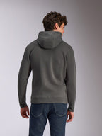 Sweat à capuche Ellipsoid Alpinestars, gris Gunmetal, vêtement de sport décontracté, vue arrière d'un homme portant un sweat à capuche en polaire, ourlet et poignets côtelés, associé à un jean bleu